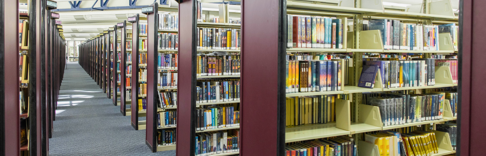 A photograph of the bookshelves at the Grant R. Brimhall Library.