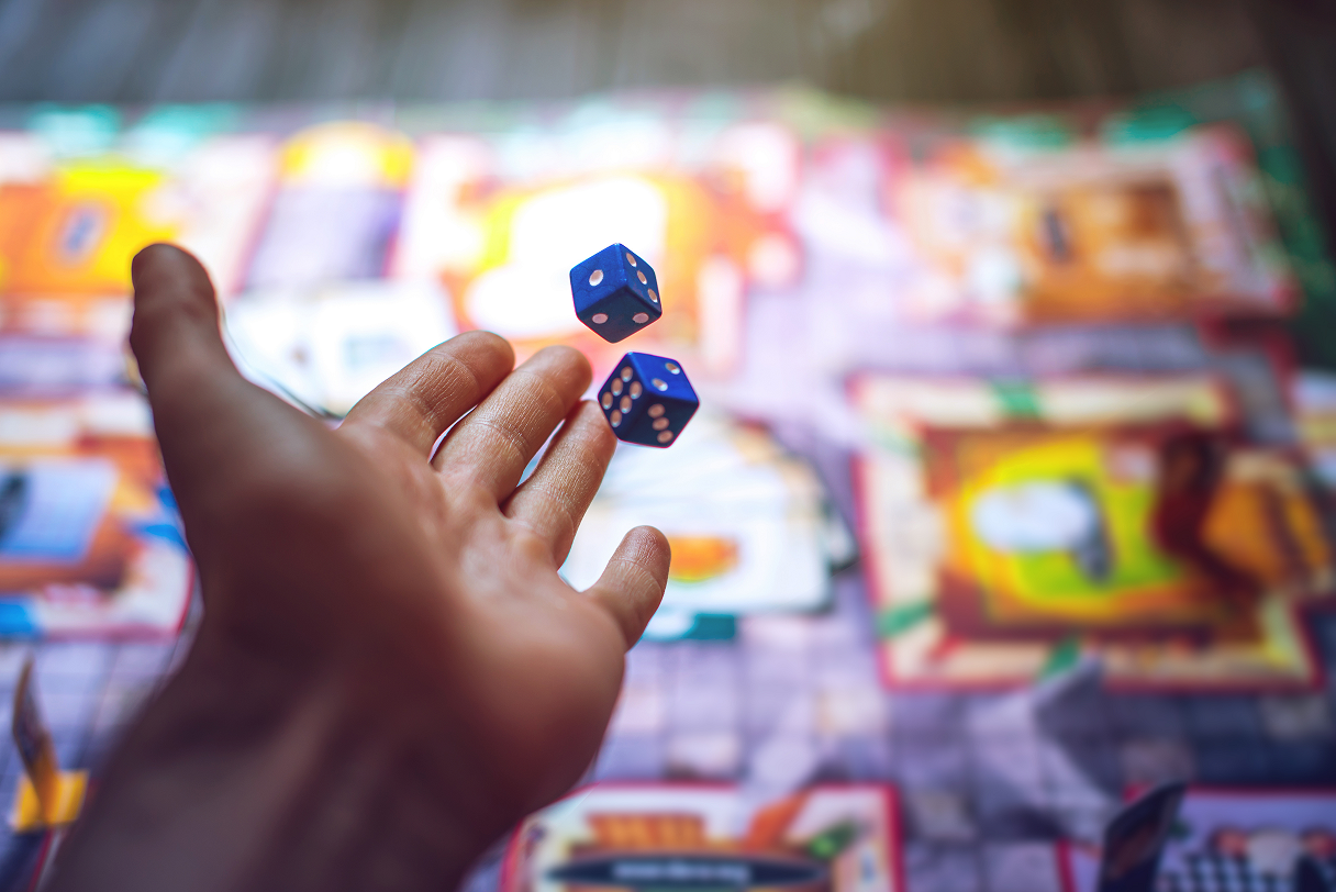 hand throwing dice for game