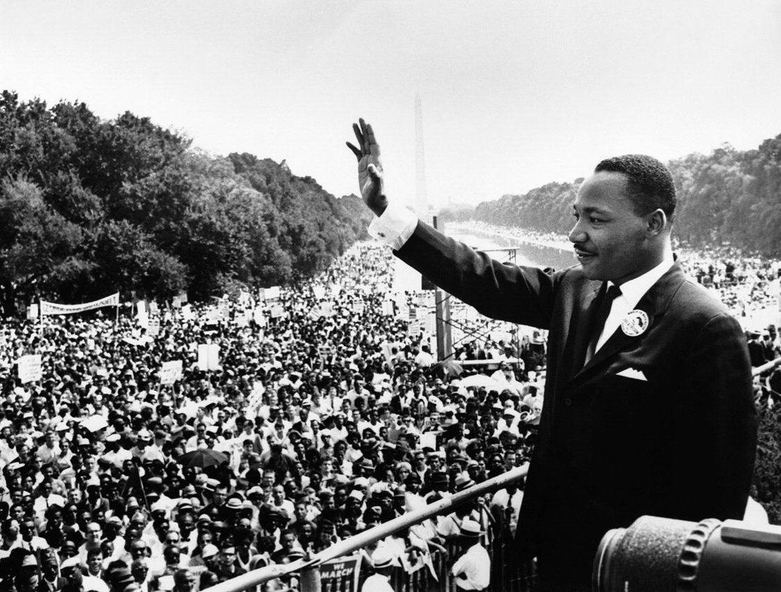 Martin Luther King Jr. waves to crowds during the 1963 March on Washington