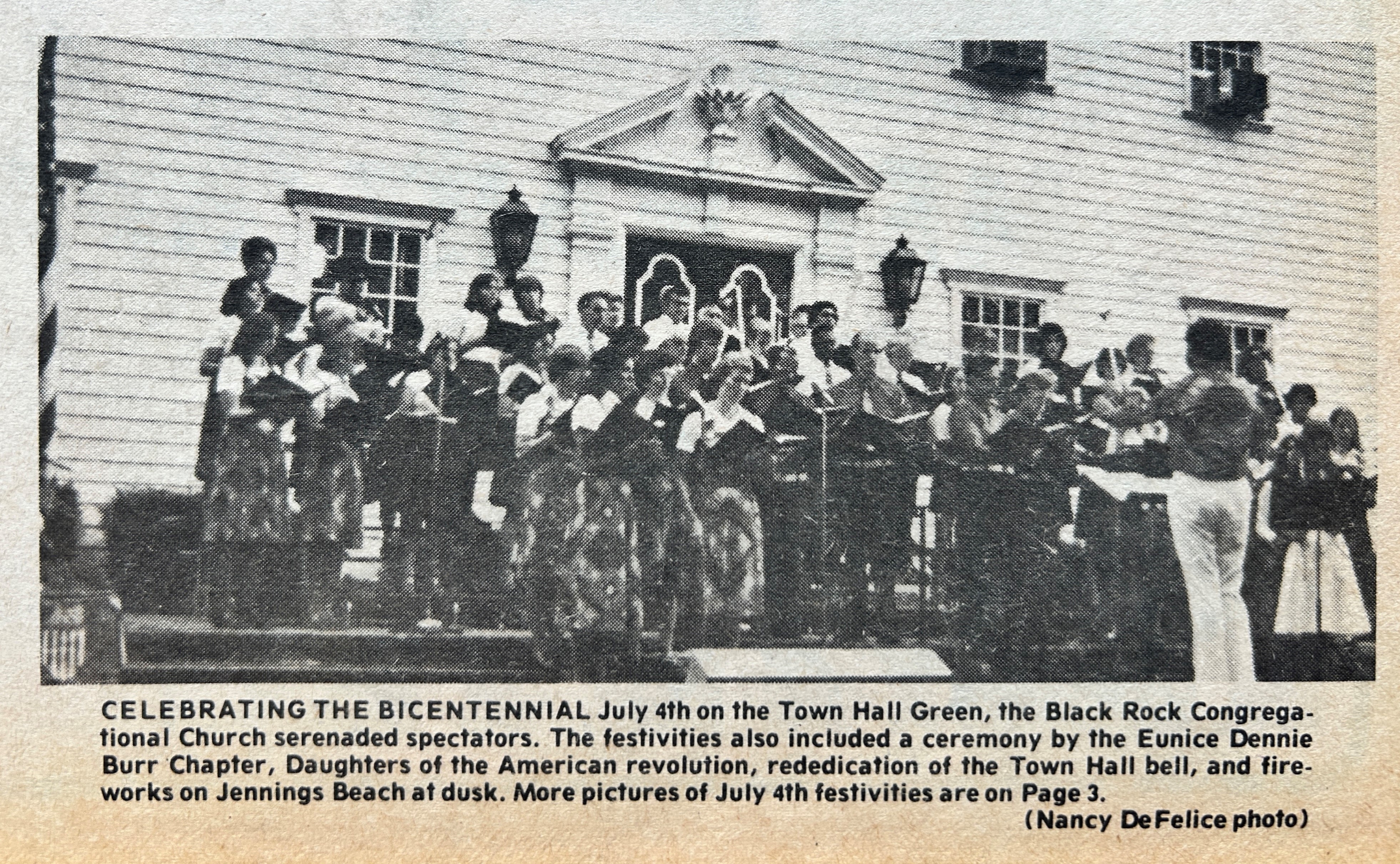 people in front of town hall from newspaper