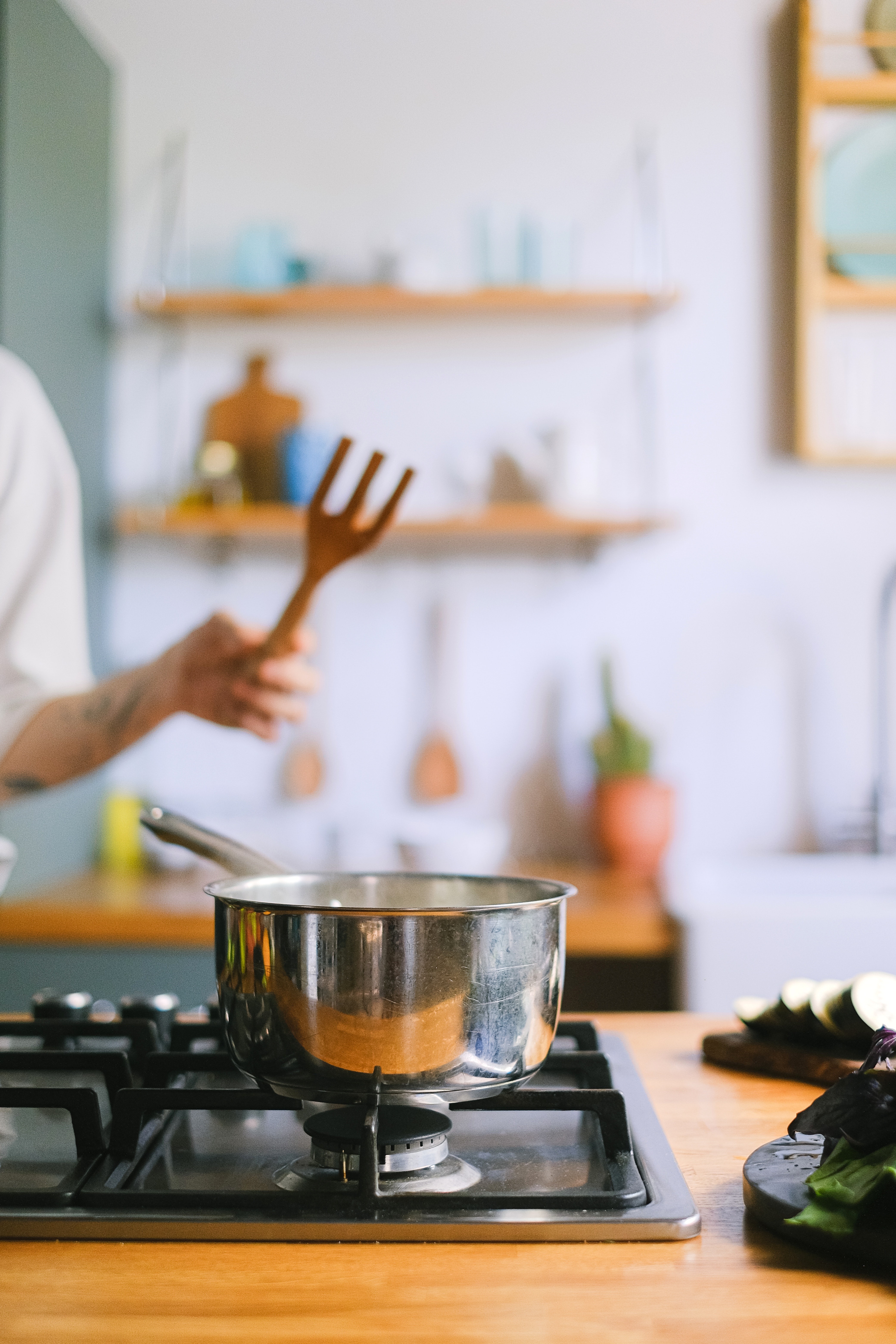 Person Cooking on Kitchen Stove