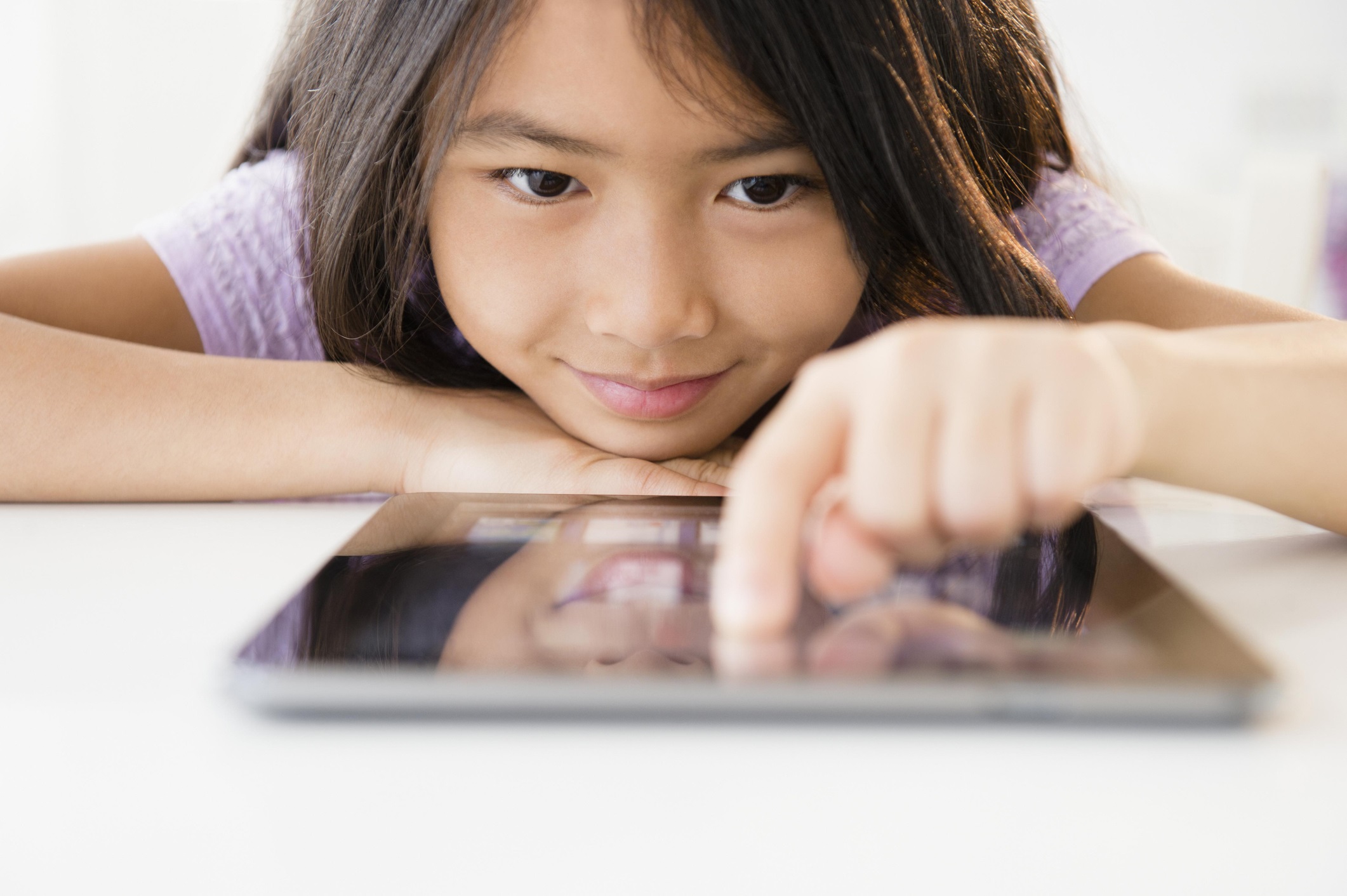 Close Up of a Girl Using a Tablet