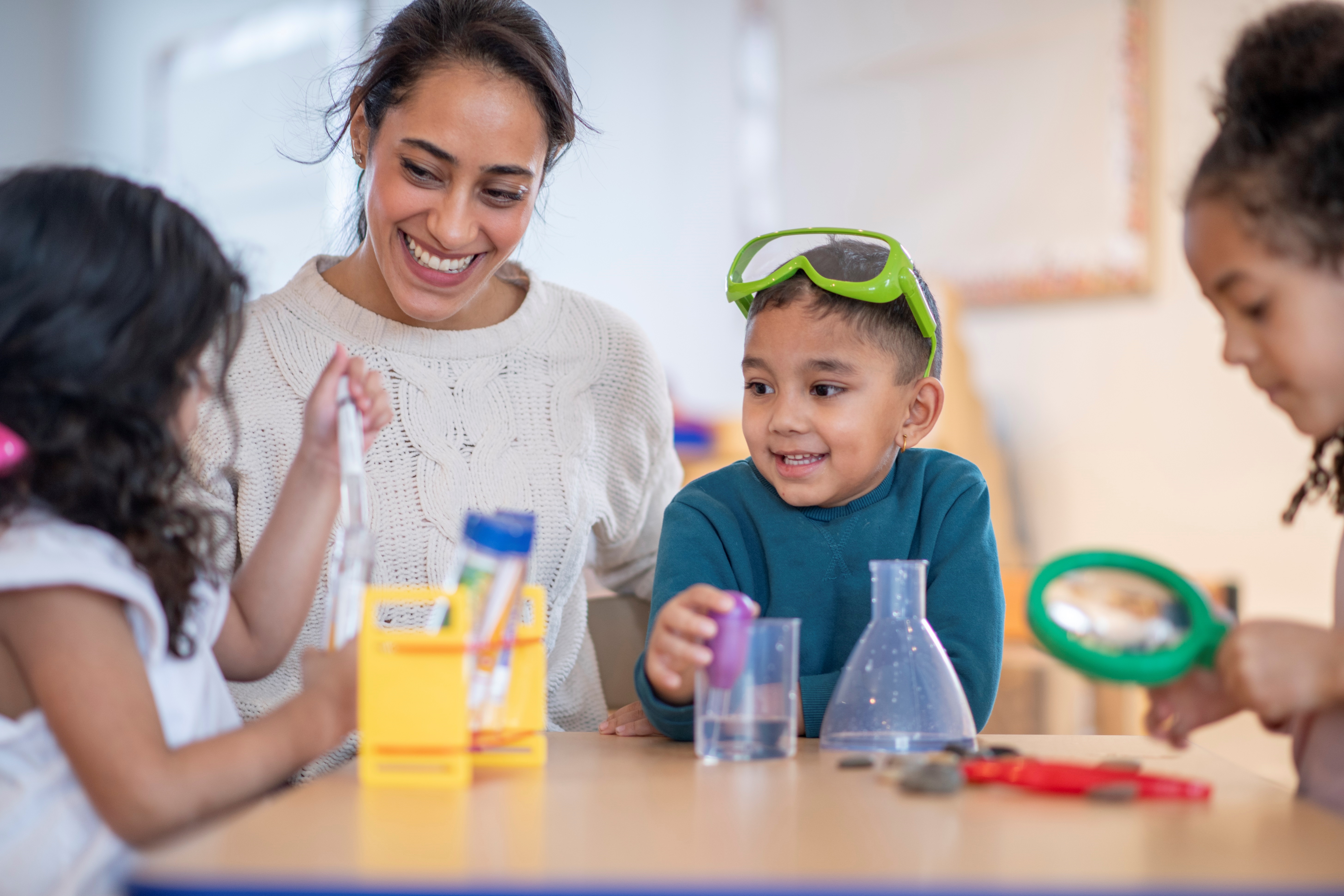 Teacher Exploring Science With Young Students