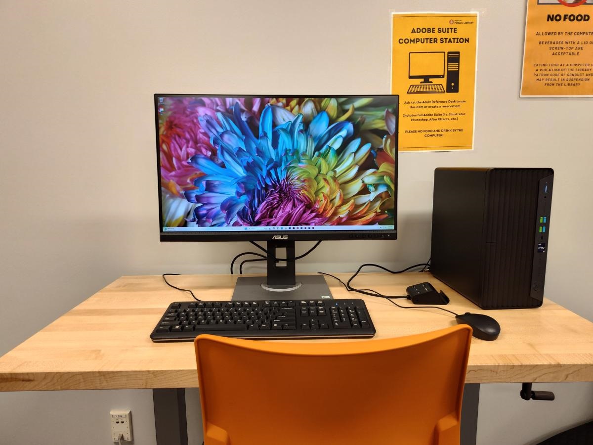 A desktop computer with a colorful screen saver 