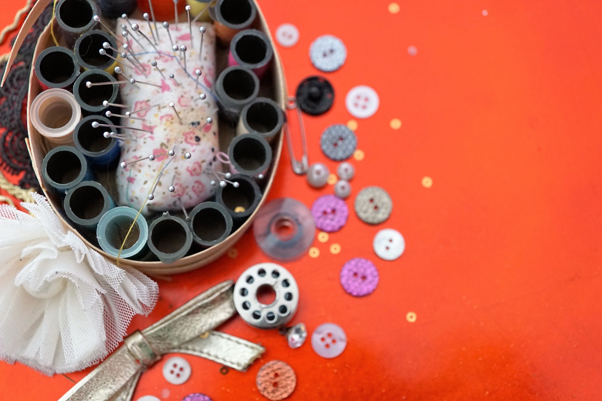 Sewing Supplies on Red Background