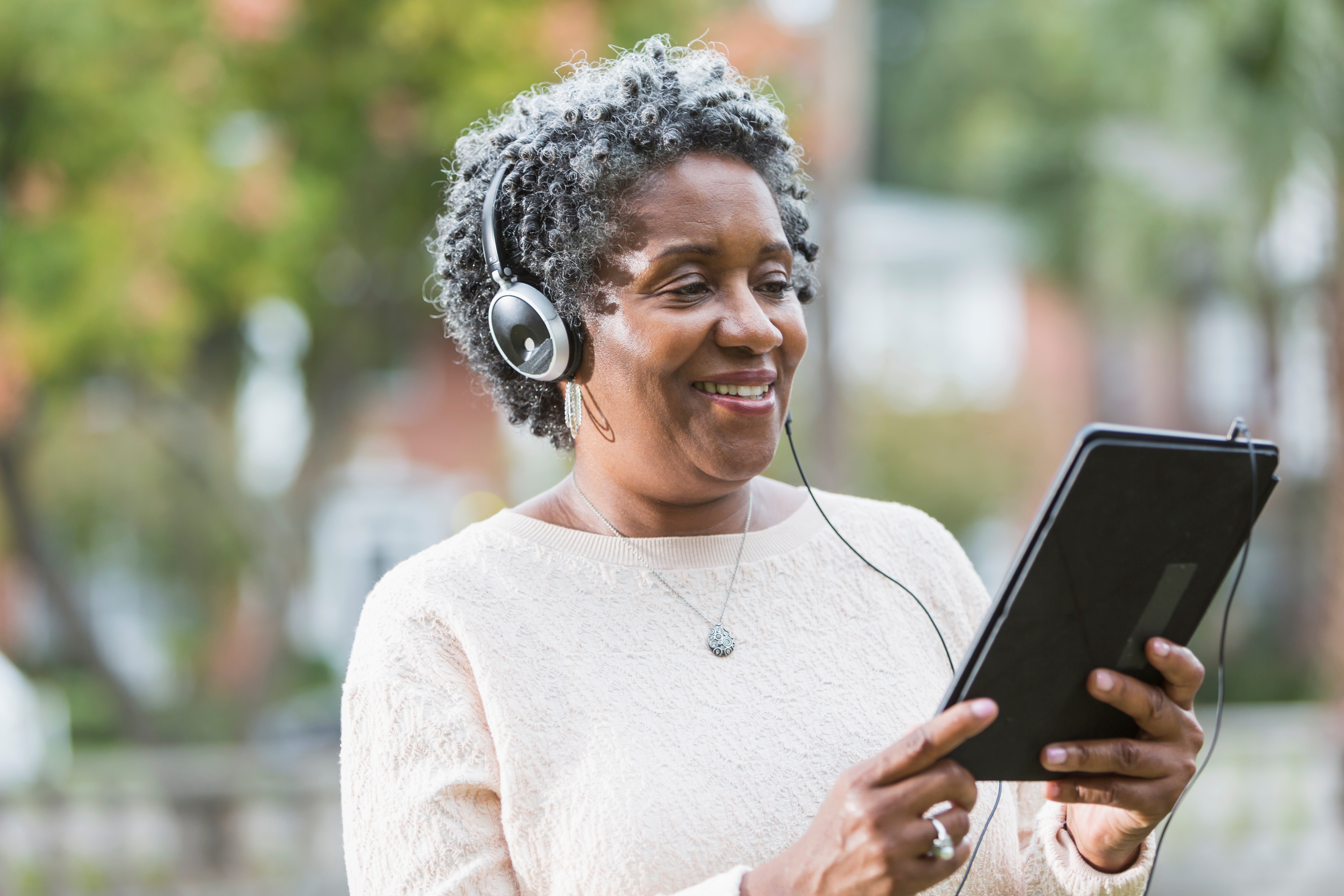 Senior Woman using Digital Tablet 