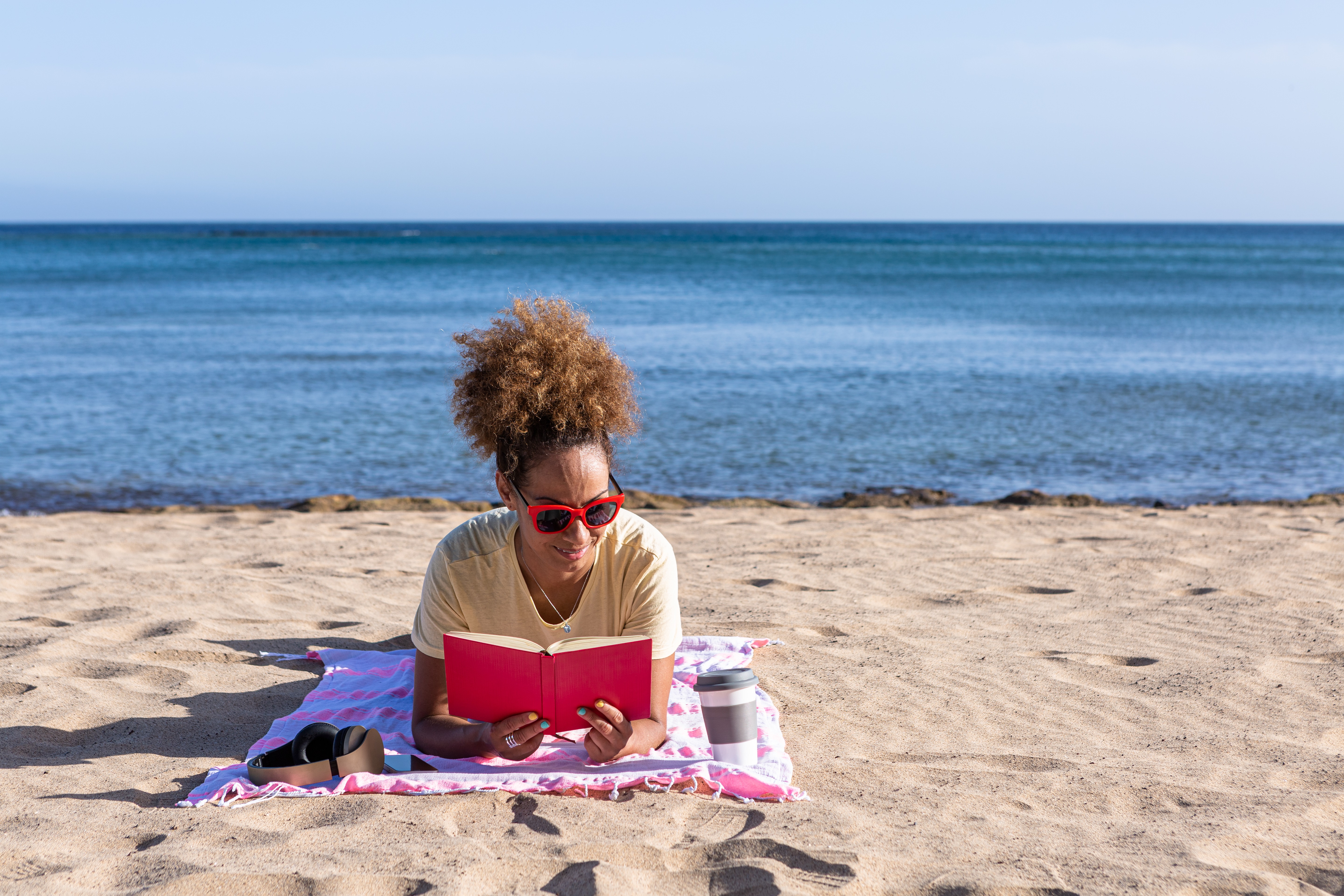 Woman reading on a beach