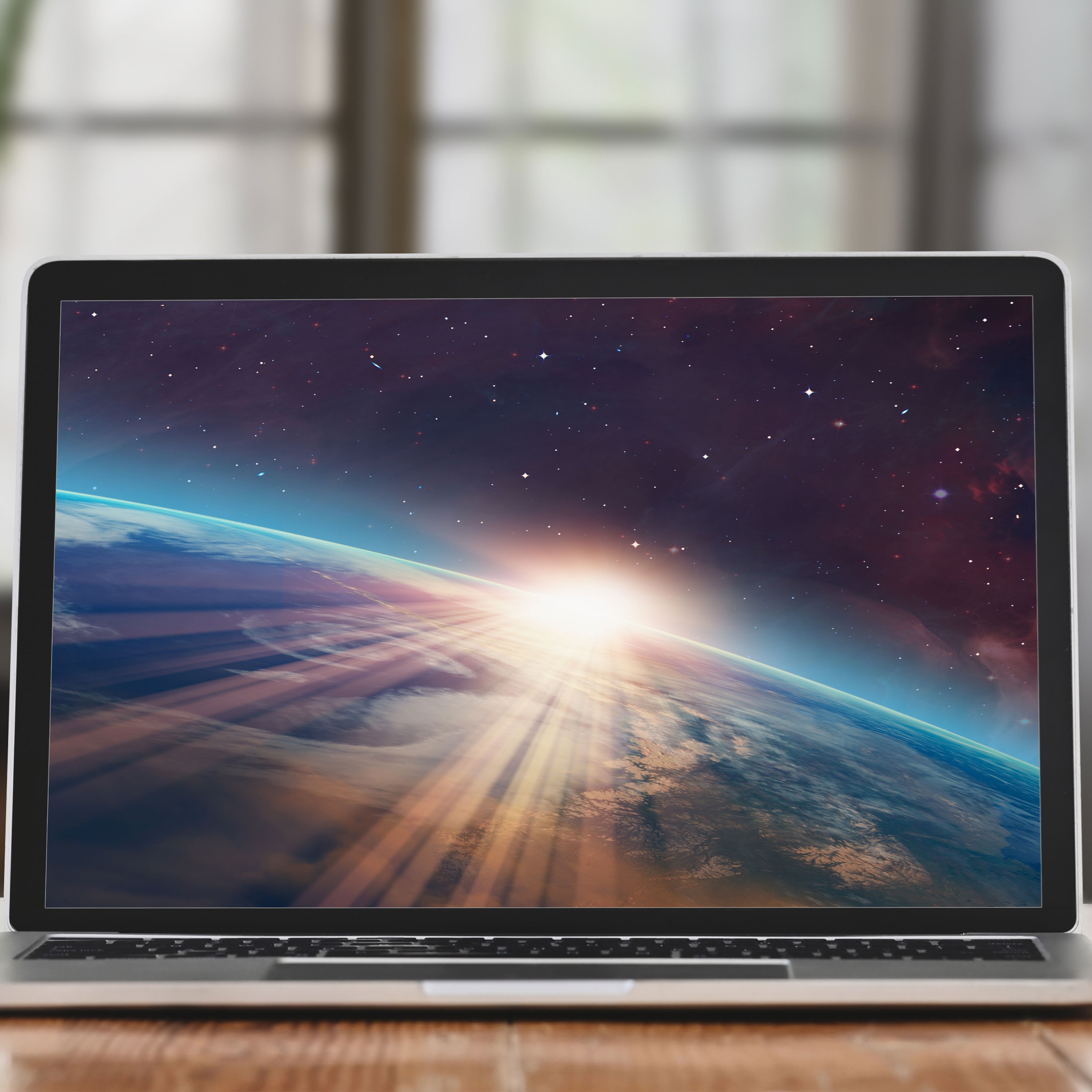 laptop with the earth on the screen