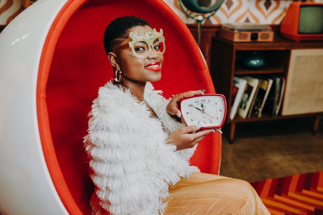 White Table Clock and Books on Bookshelf