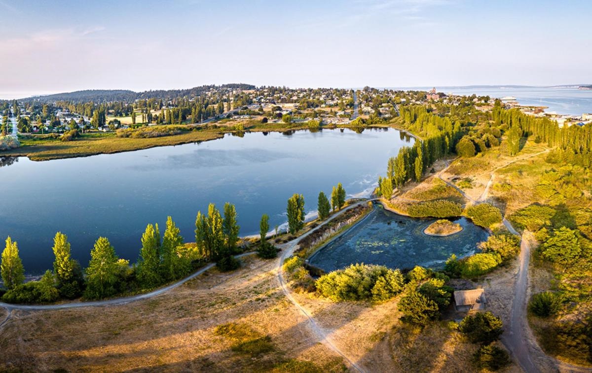overhead view of Kah Tai Lagoon. A lagoon with a trail next to it.