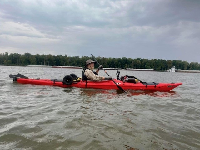 Beau Baker on a kayak paddling the Mississippi