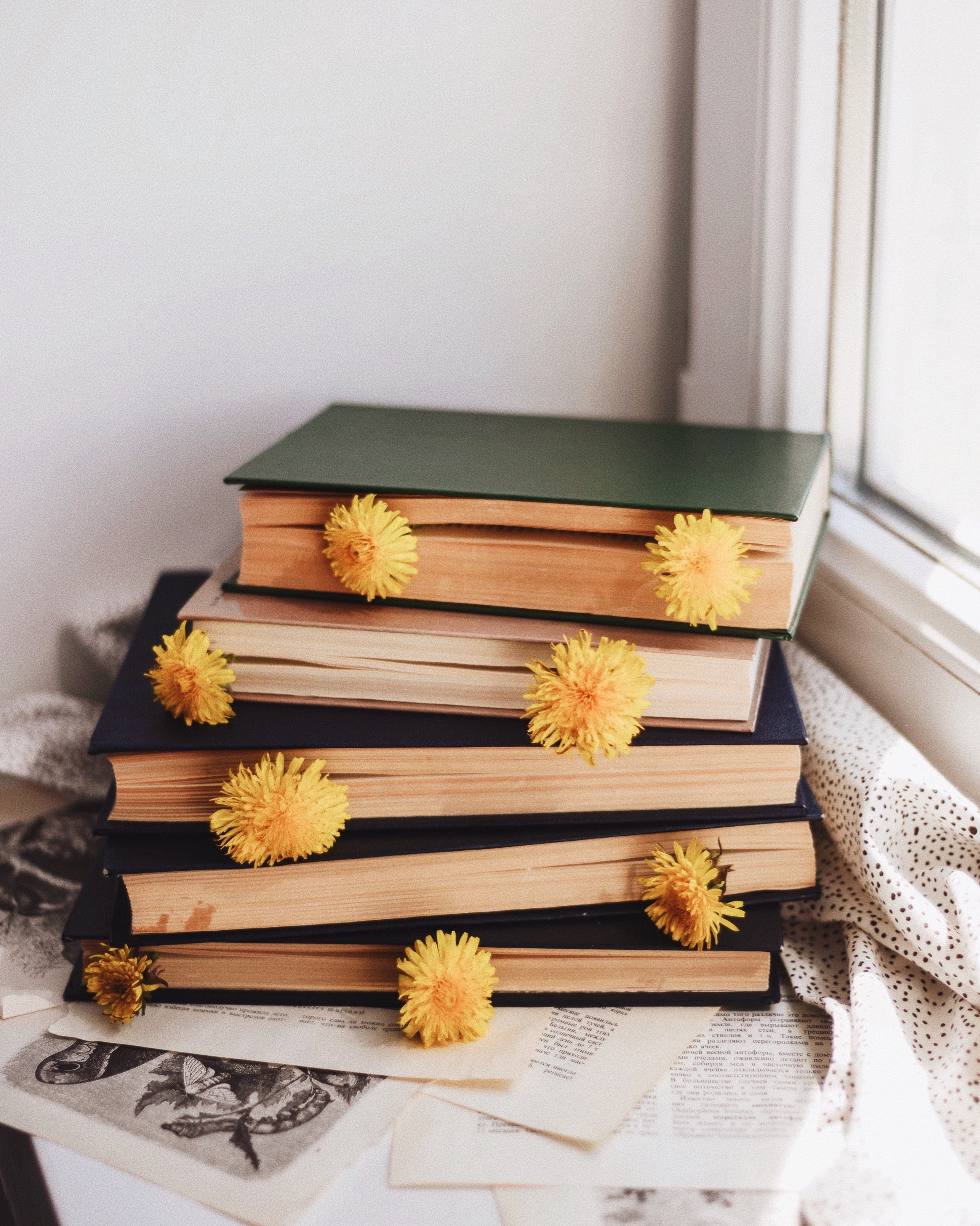 Stack of Books with Yellow Flowers