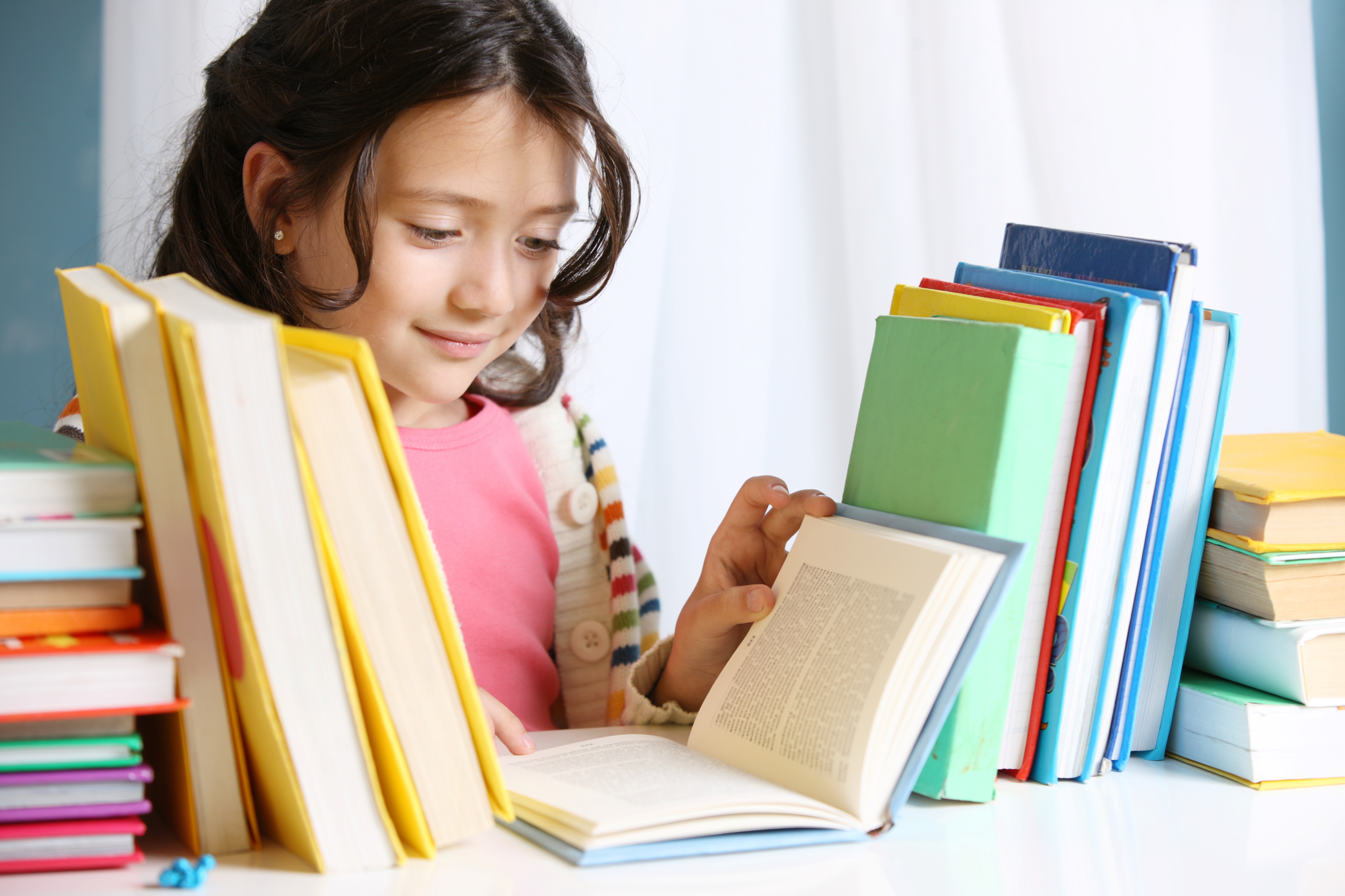 A School Girl Reading a Book in the Library