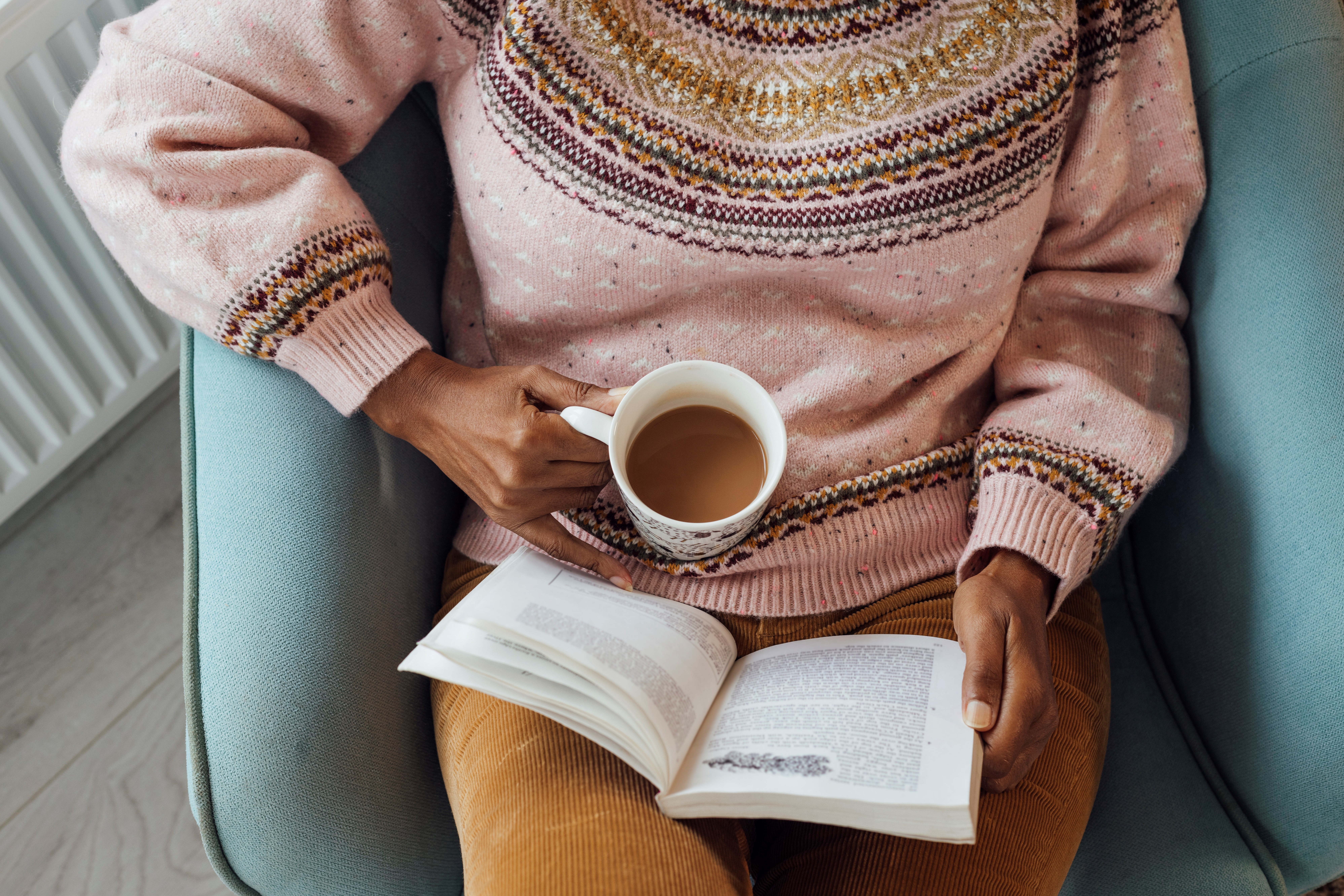 Woman Reading A Book With A Hot Drink