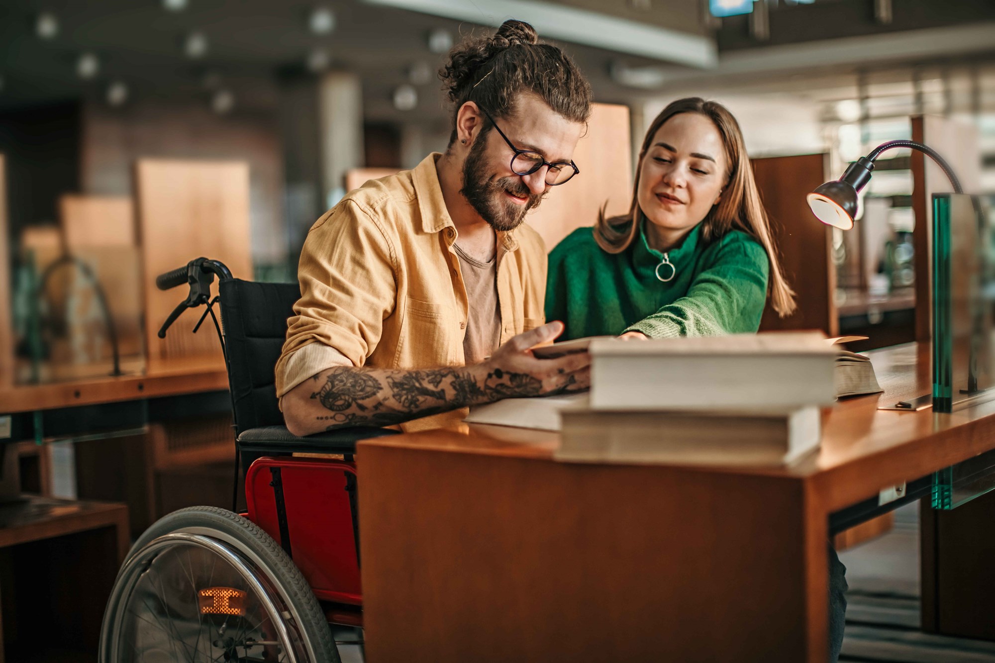 two girls in library reading