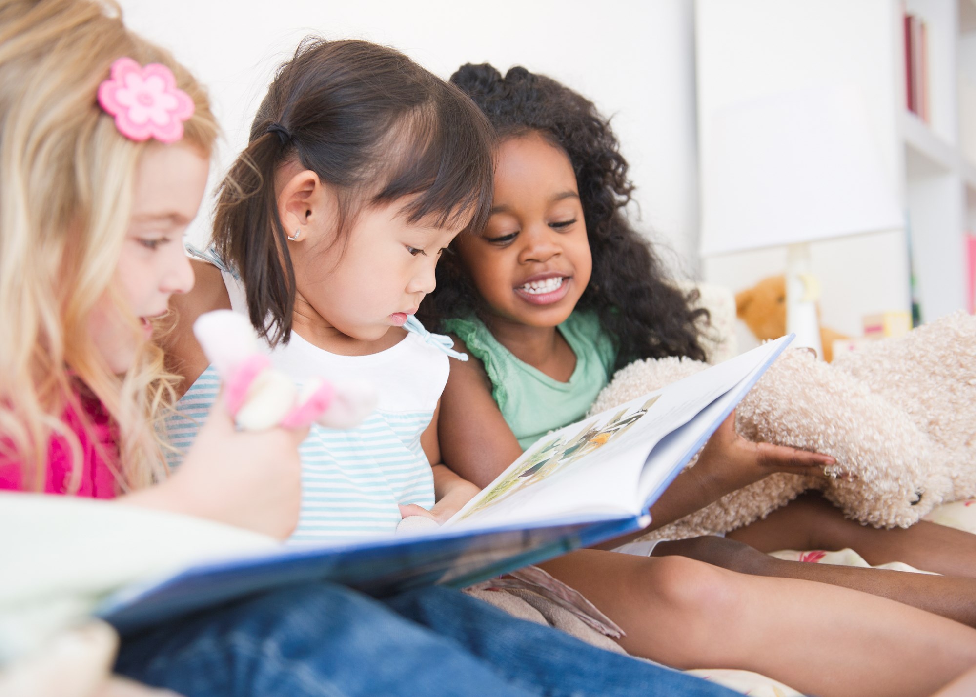 two girls in library reading two girls in library reading