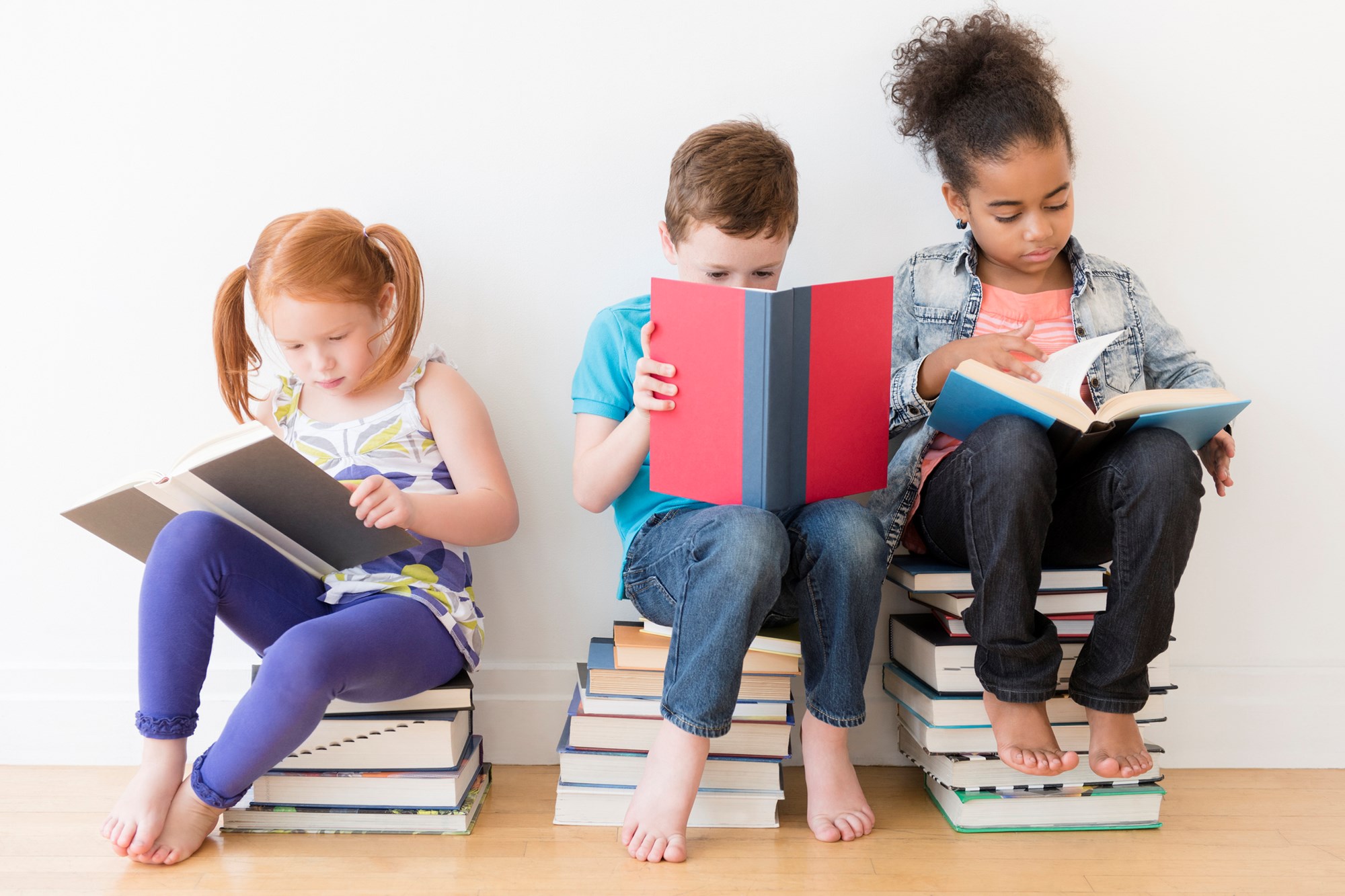 two girls in library reading