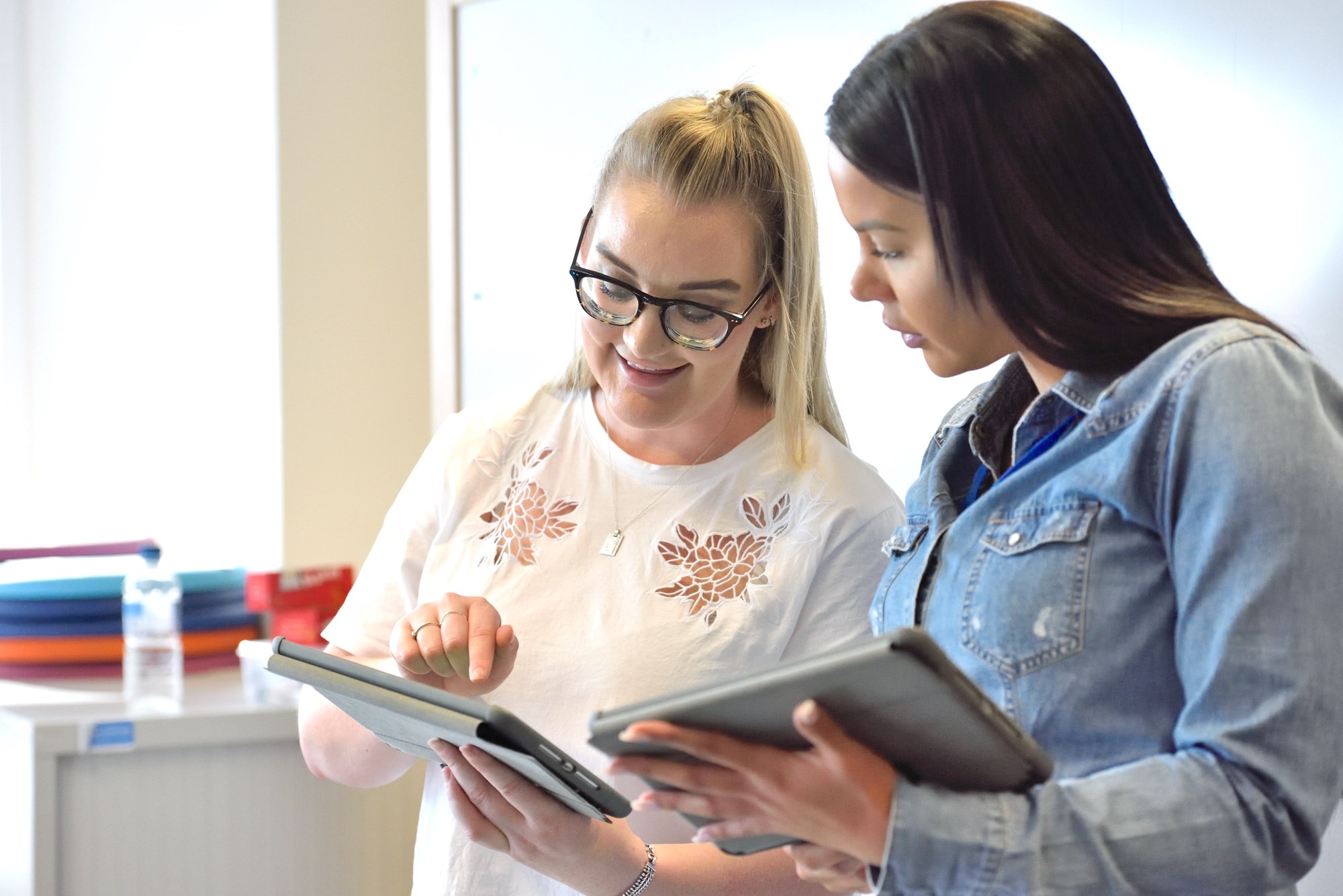 two girls in library reading