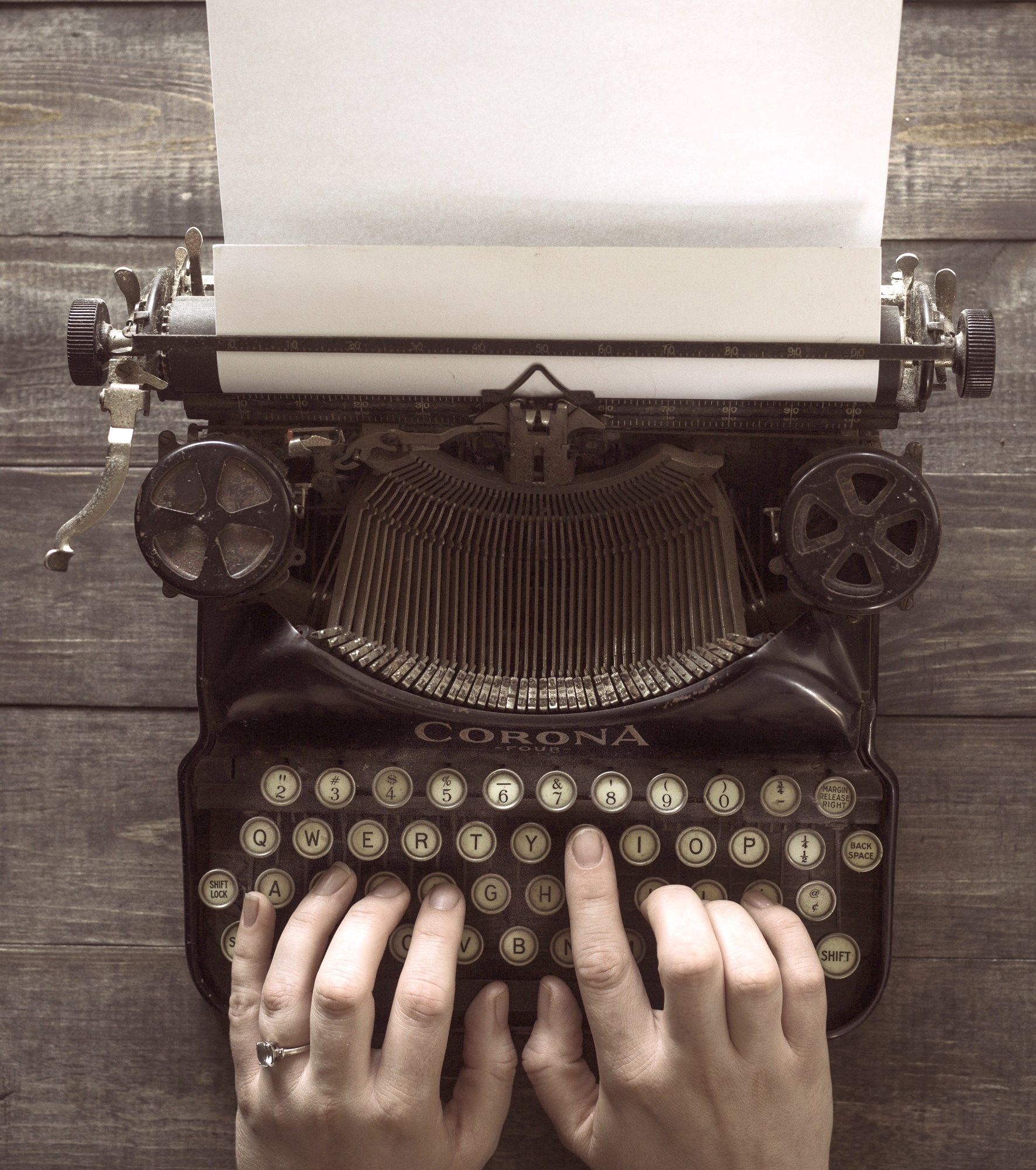Woman Using a Old Typewriter
