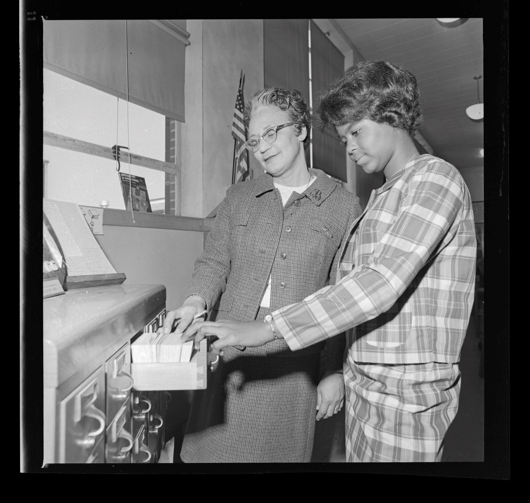 Librarian and student using the card catalog at R.R. Moton High School, 1966-1967