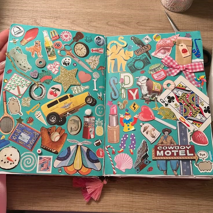 Smiling Girl with Mobile Phone Sitting at Table in Home