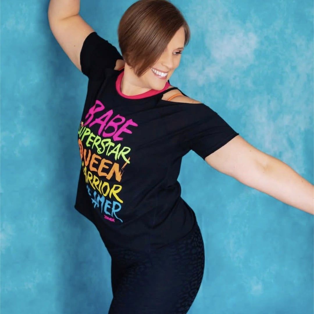 Woman Holding a Tablet Against Blank Wall