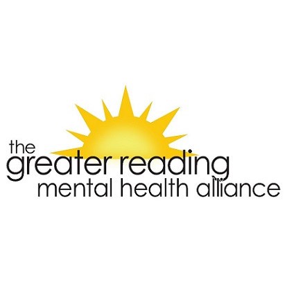 Woman Holding a Tablet Against Blank Wall