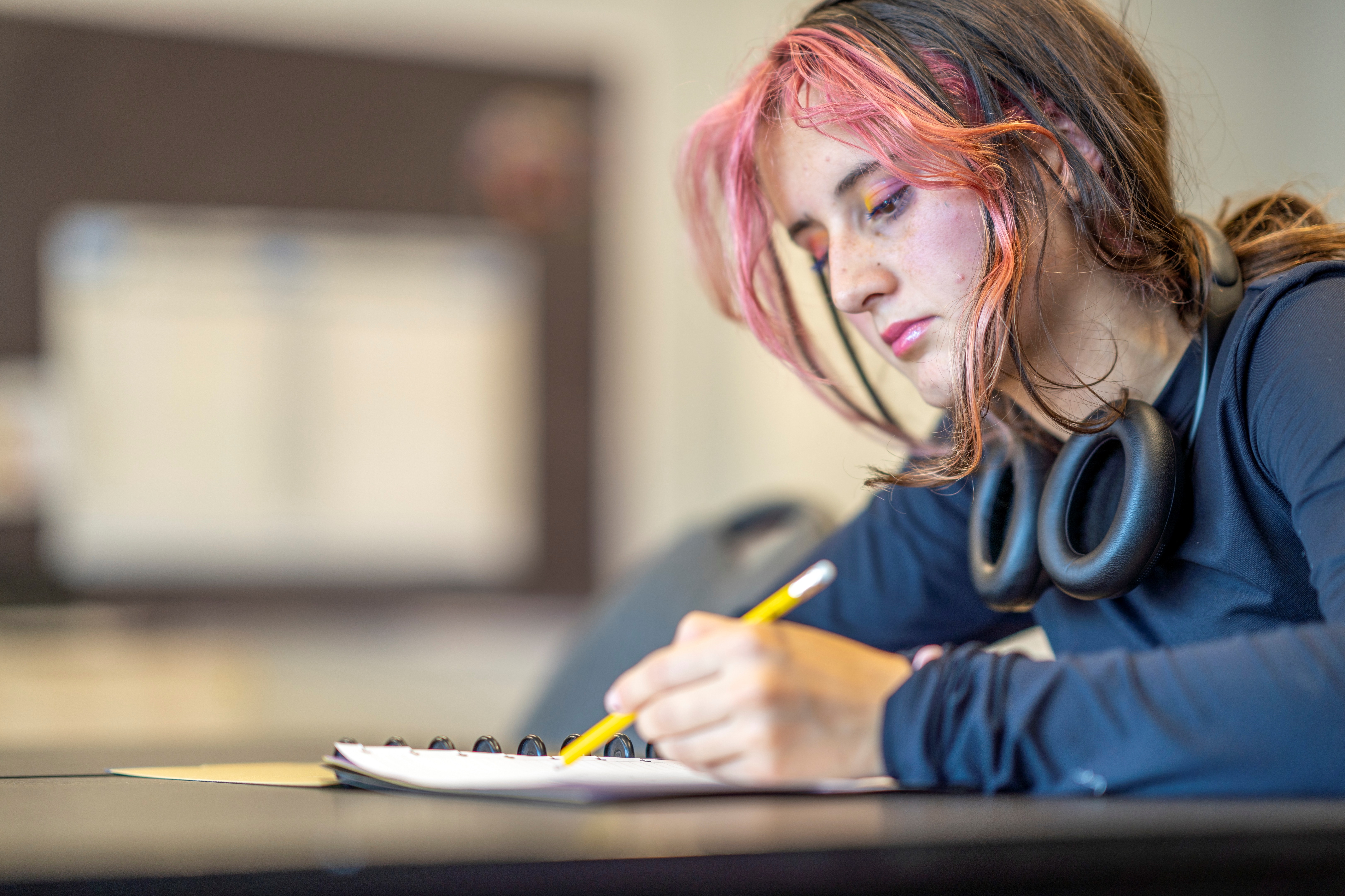 Female High School Student Making Notes