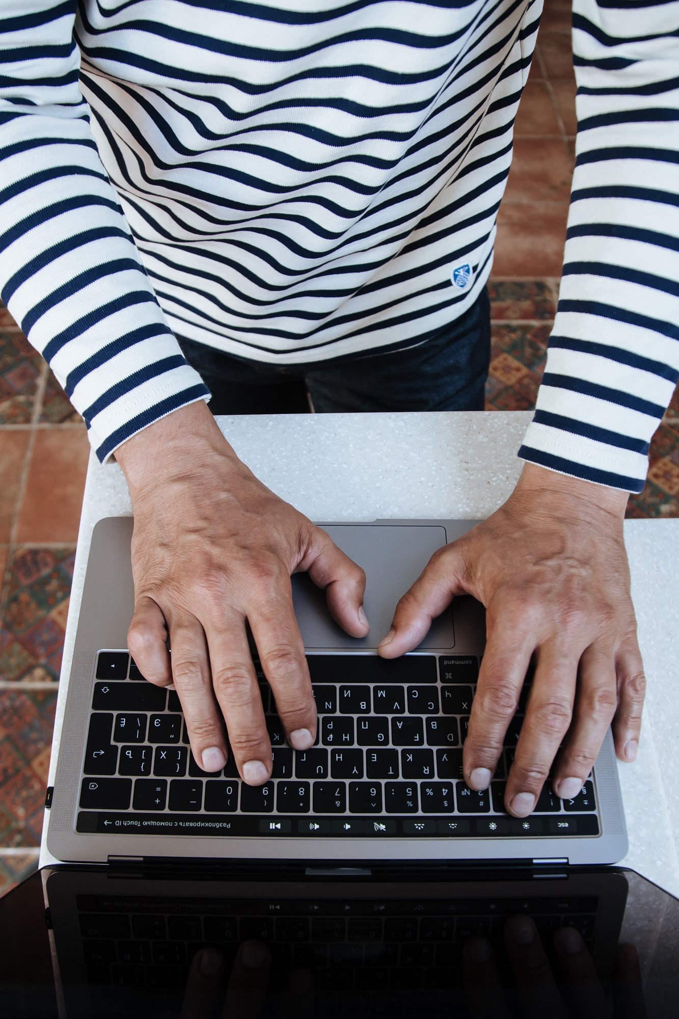 Top View of Senior Man Hands Typing on Laptop