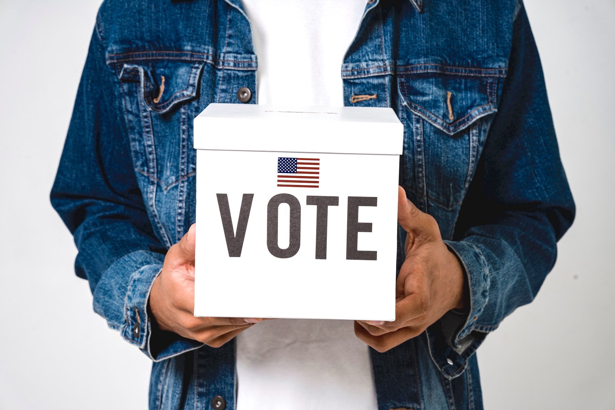 Person Holding a Voting Ballot Box