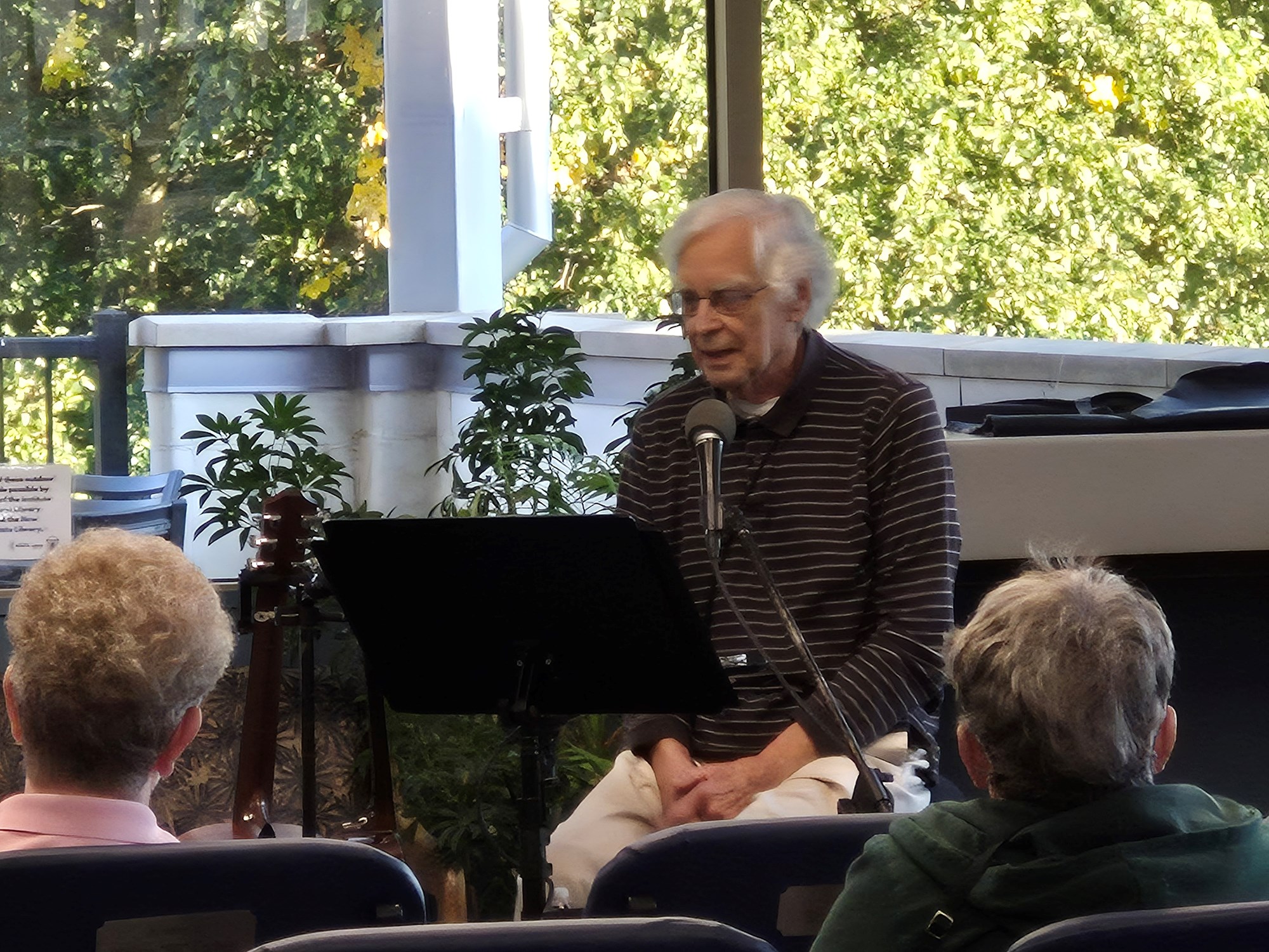 Ramblin' Richard performing in the main seating area of the library.