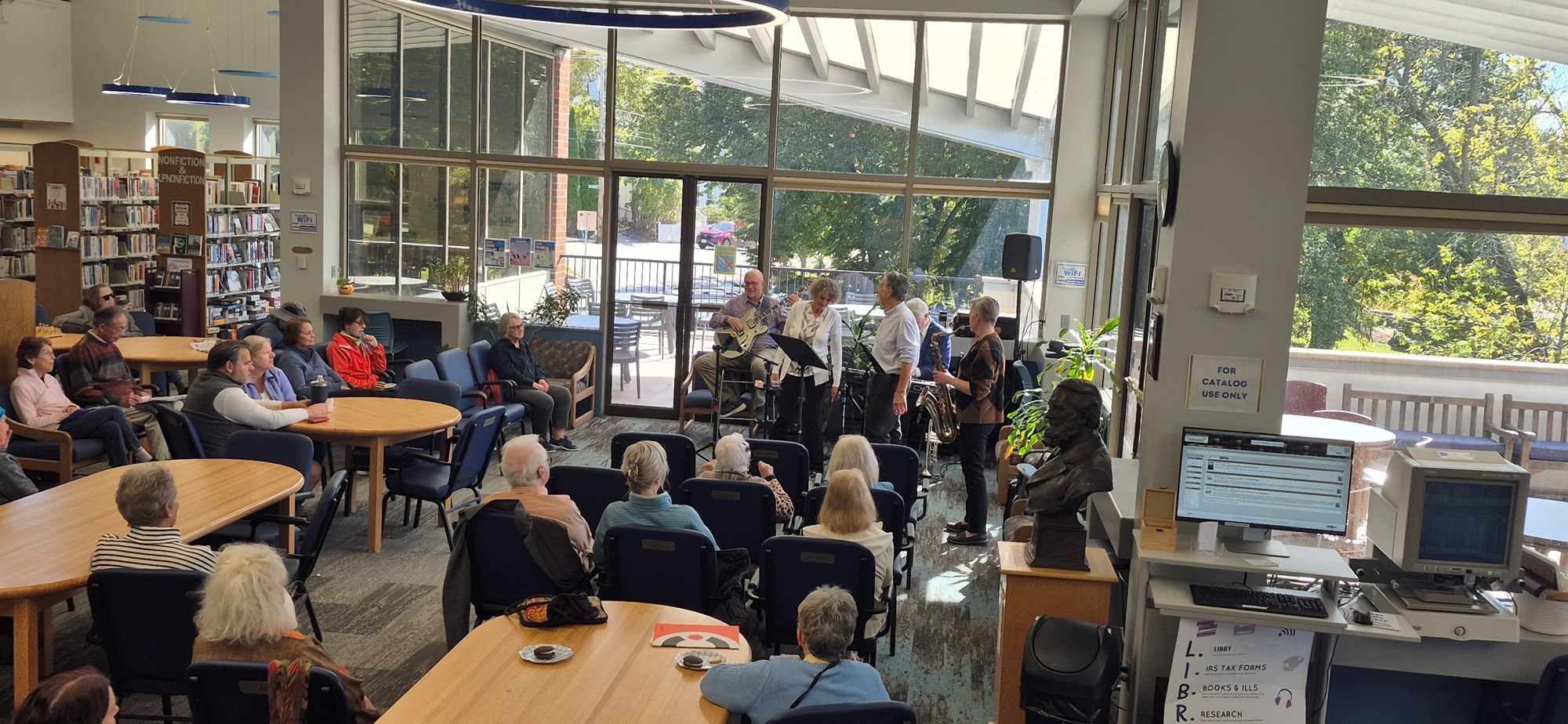 Now's the Time performing in the Main Seating area of the library.