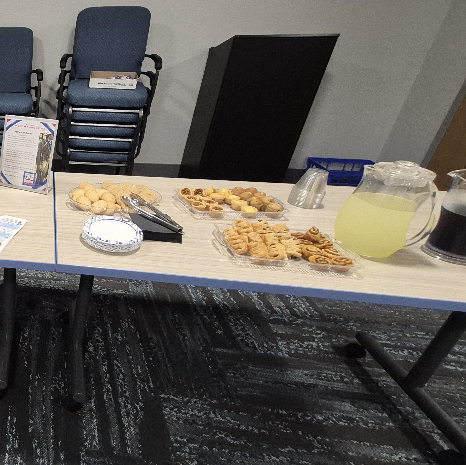 Snacks and some of the beverages for the tea party on a table in the Meeting Room.