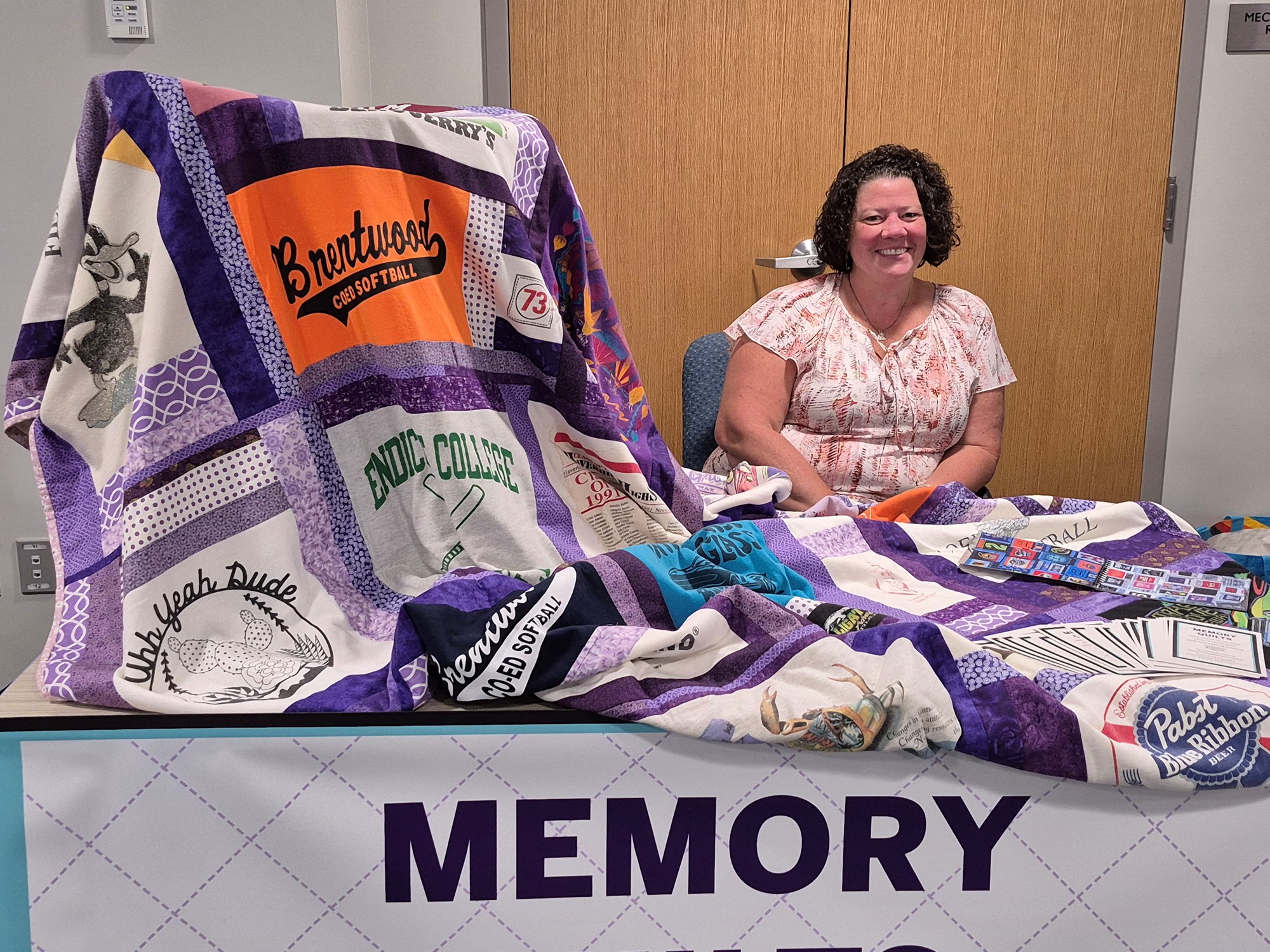 Vendor selling quilts on the mezzanine floor of the library.