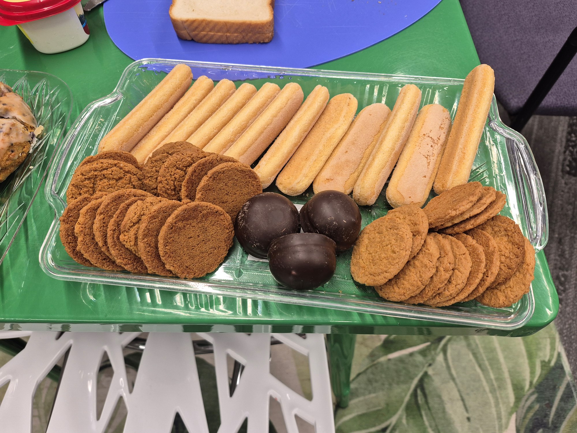 Cookies in a tray on a green table in the Teen Scene.