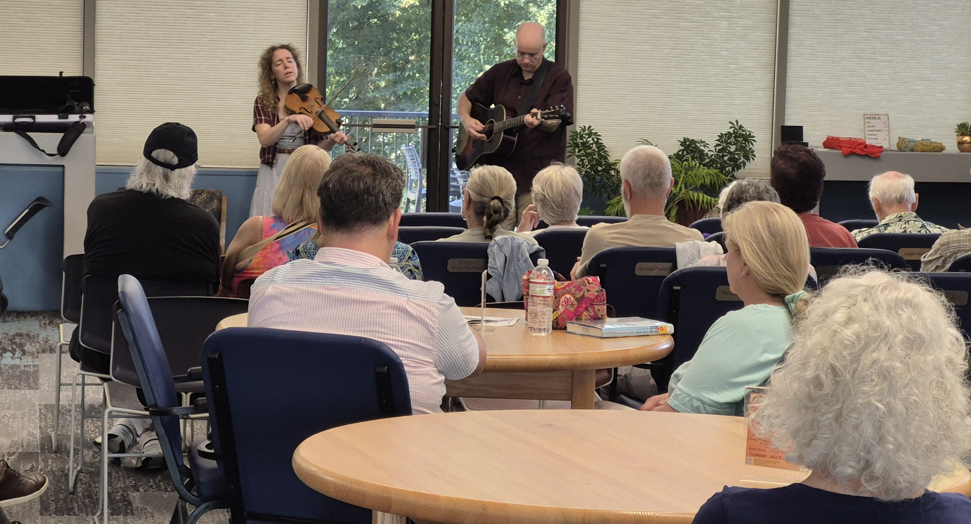 Bottom Dollars Duo performing in the main seating area of the library. Bottom Dollars Duo performing in the main seating area of the library.