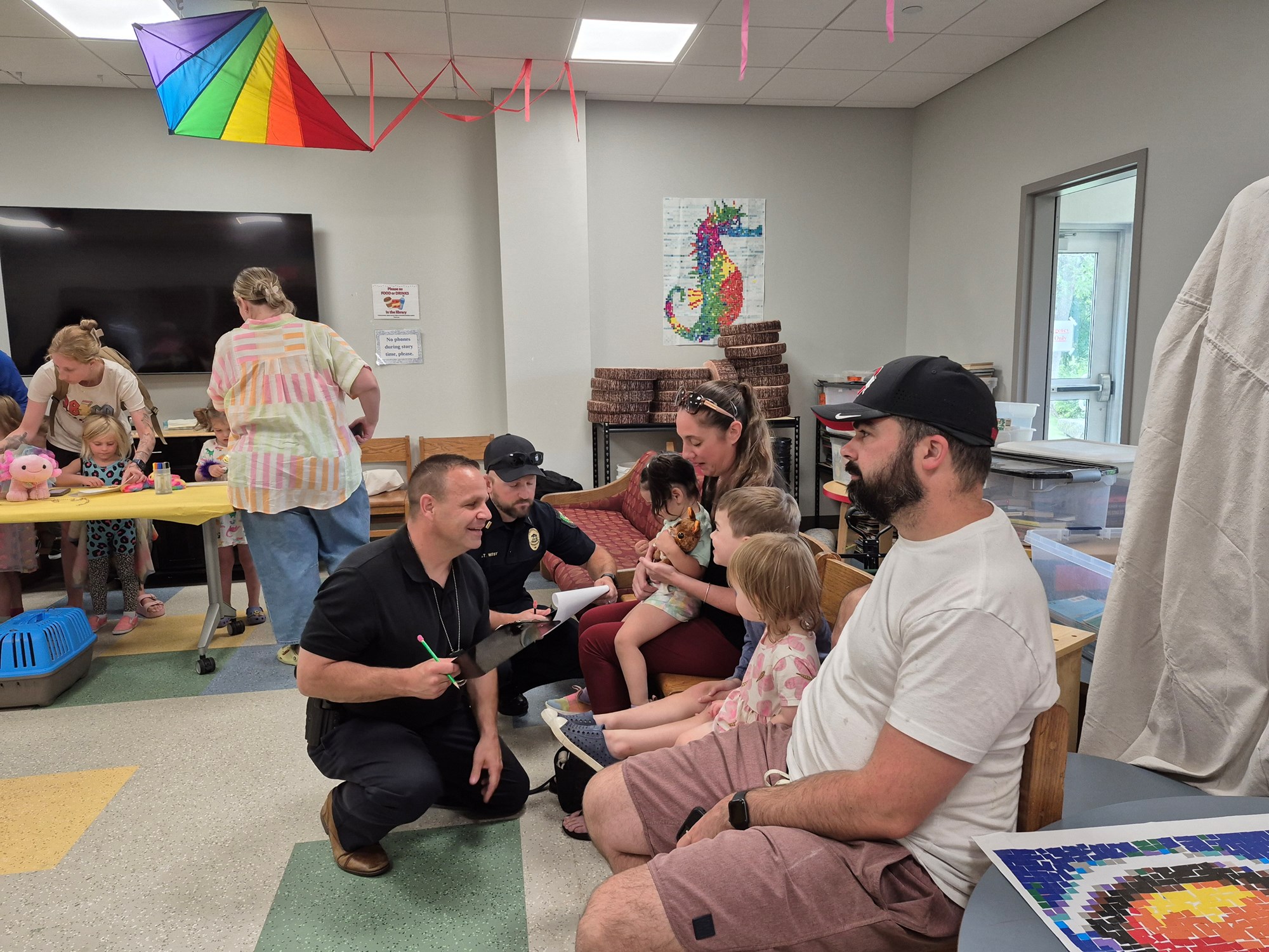 Detective Page and Lieutenant West judging the stuffed animals for the Stuffed Pet Show..