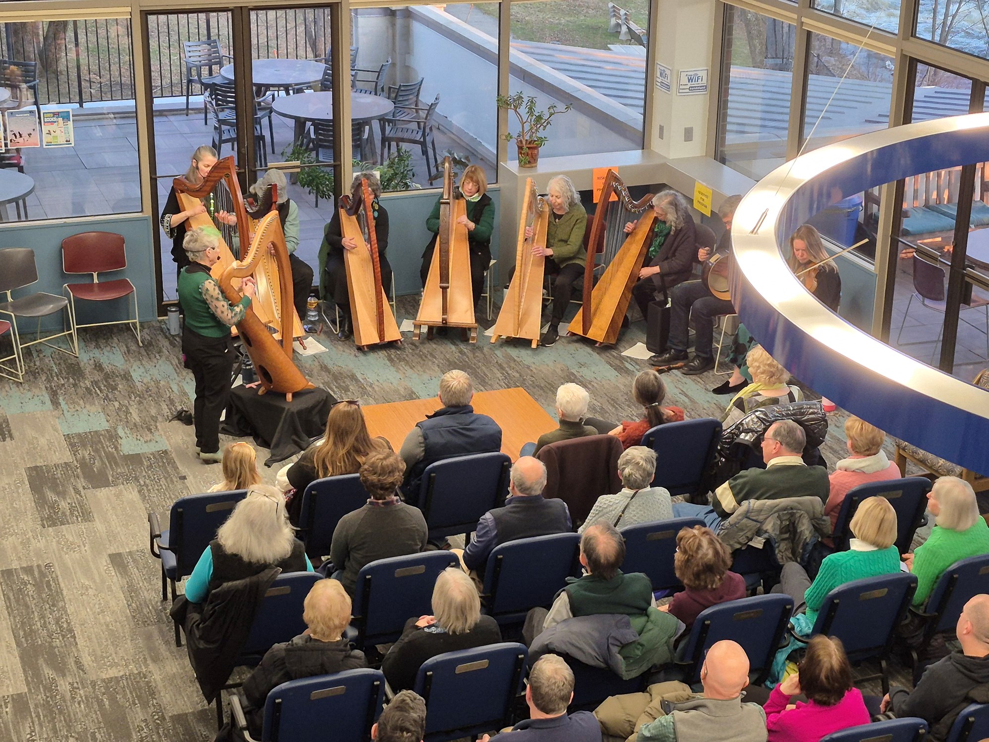 The New England Irish Orchestra performing on the main floor of the library.