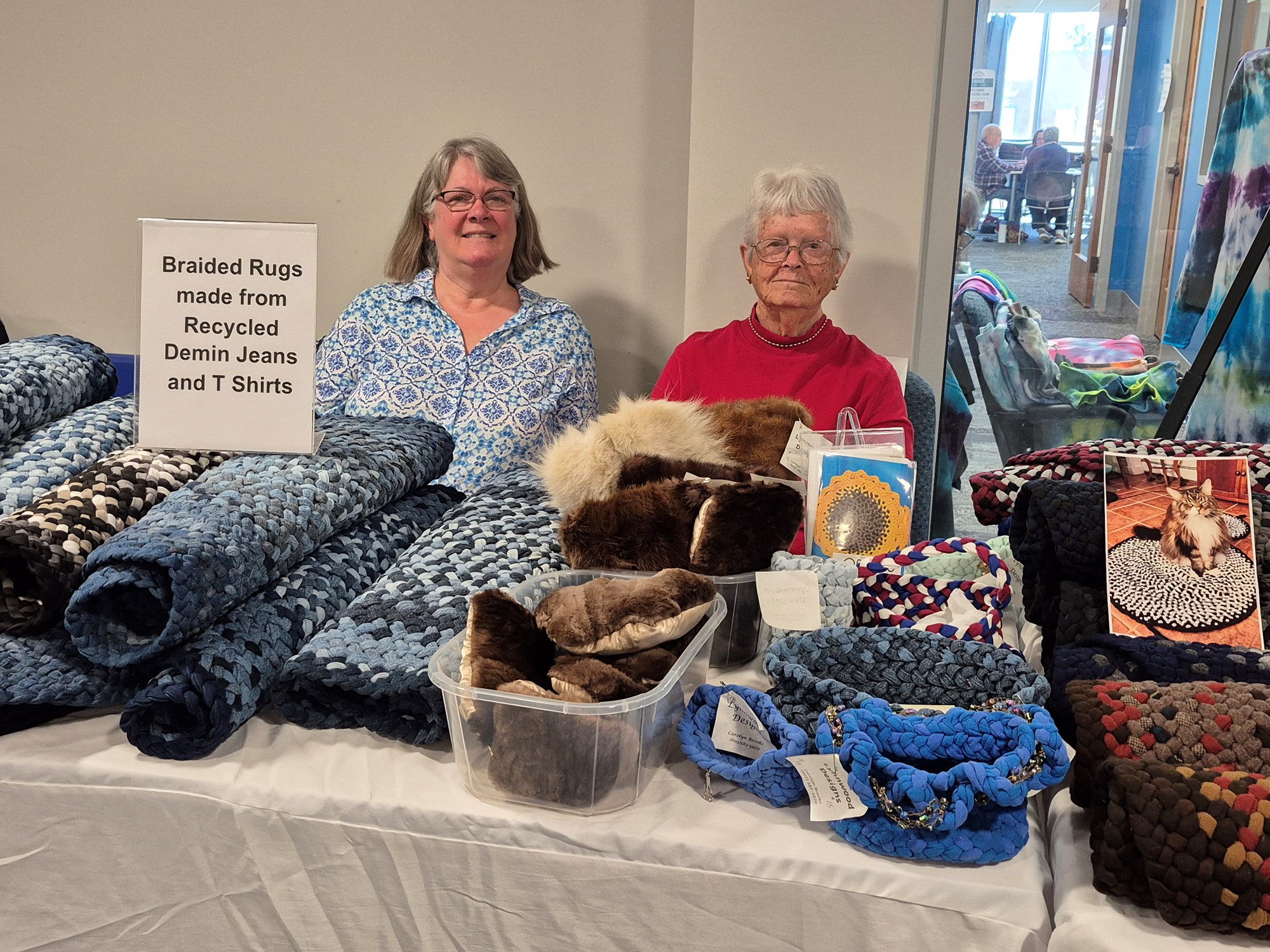 Vendors selling braided rugs made from recycled denim jeans and T-shirts on the mezzanine floor of the library.