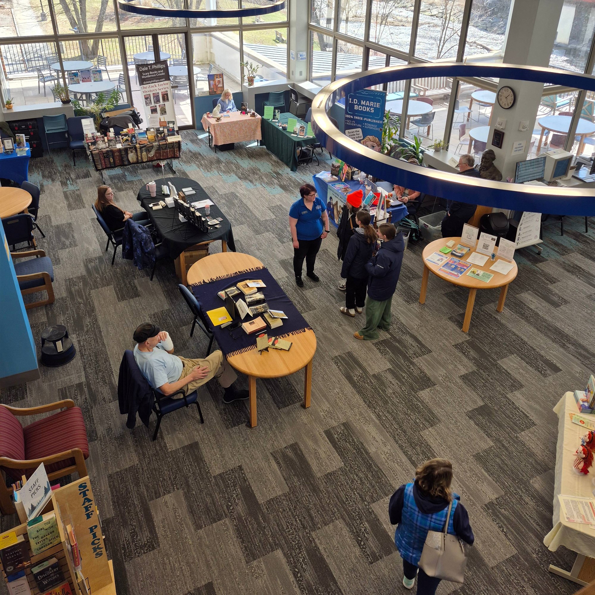 Multiple authors' booths at the Author Fair on the main floor.