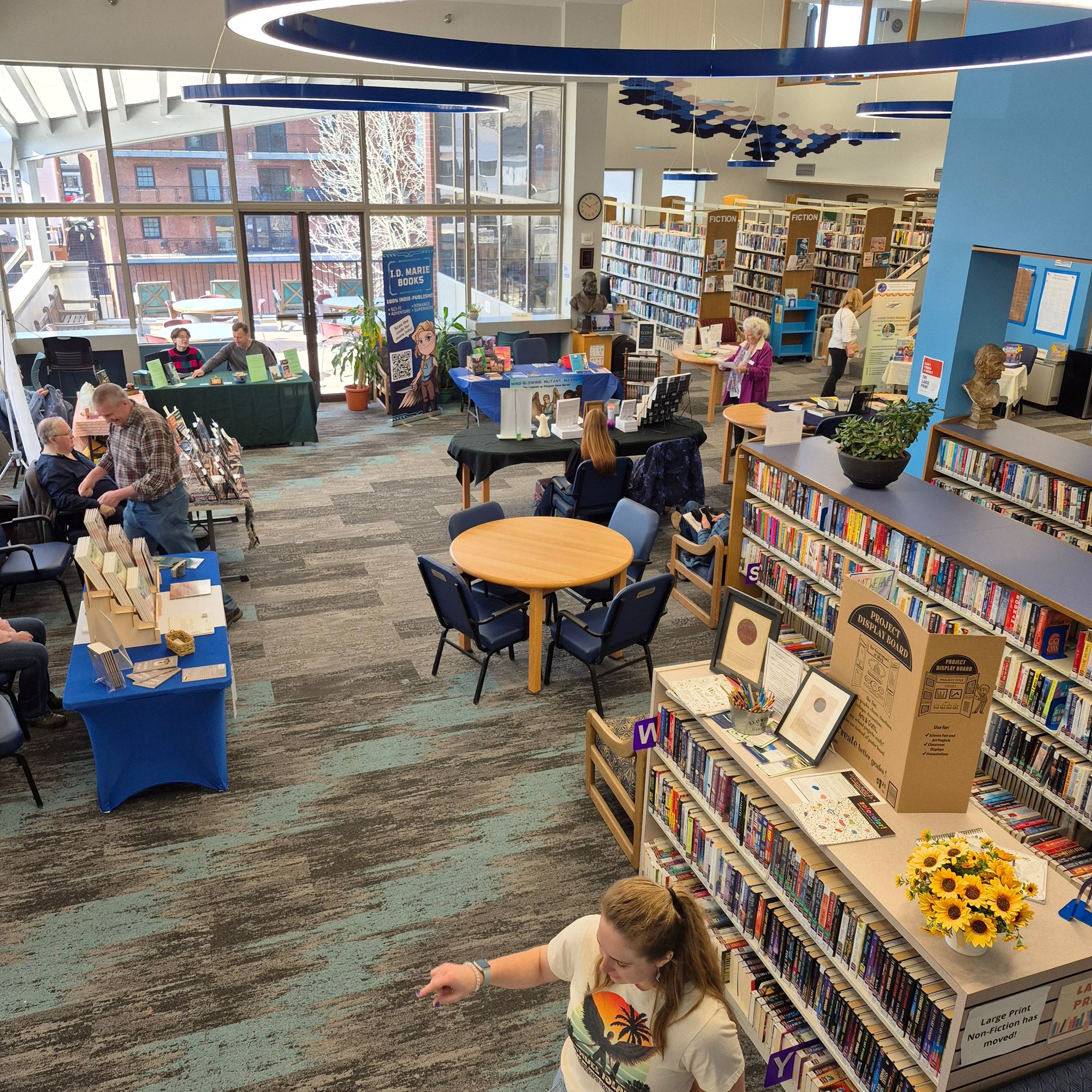 Multiple authors' booths at the Author Fair on the main floor.