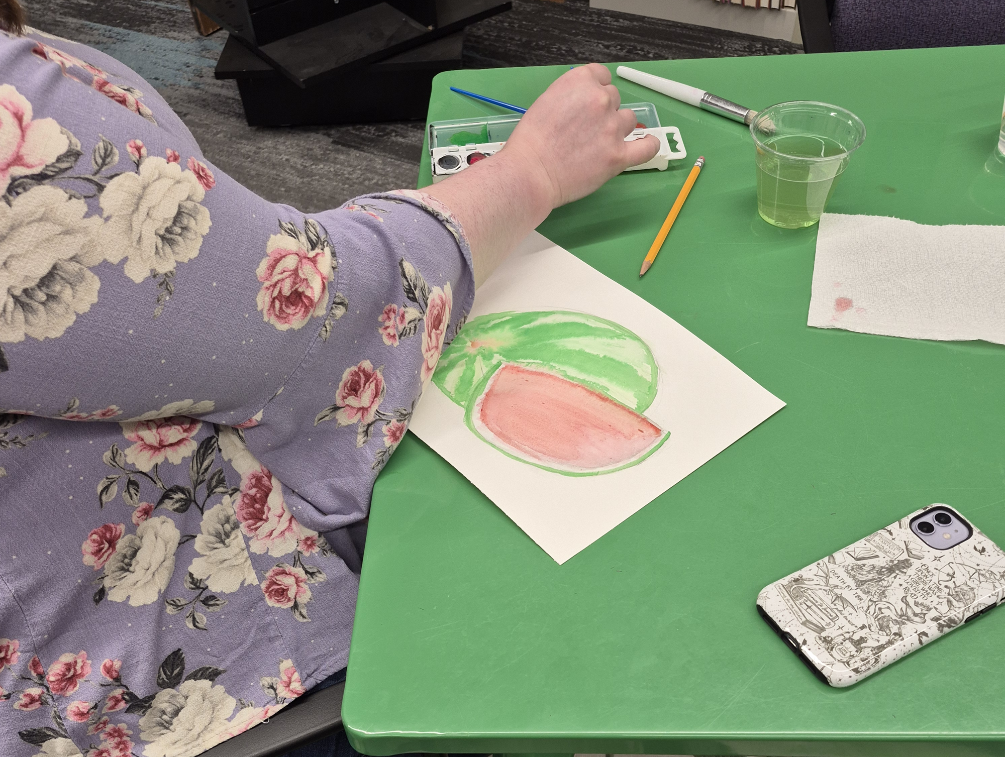 A librarian working on a painting.