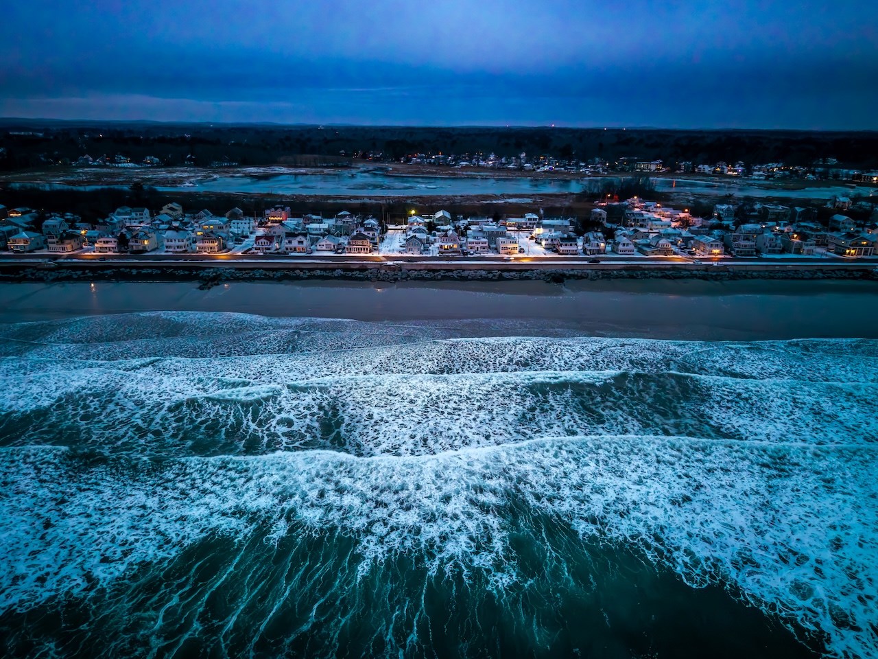 An overhead image of Hampton Beach at Dawn on Christmas Day by February artist Ed Moran.