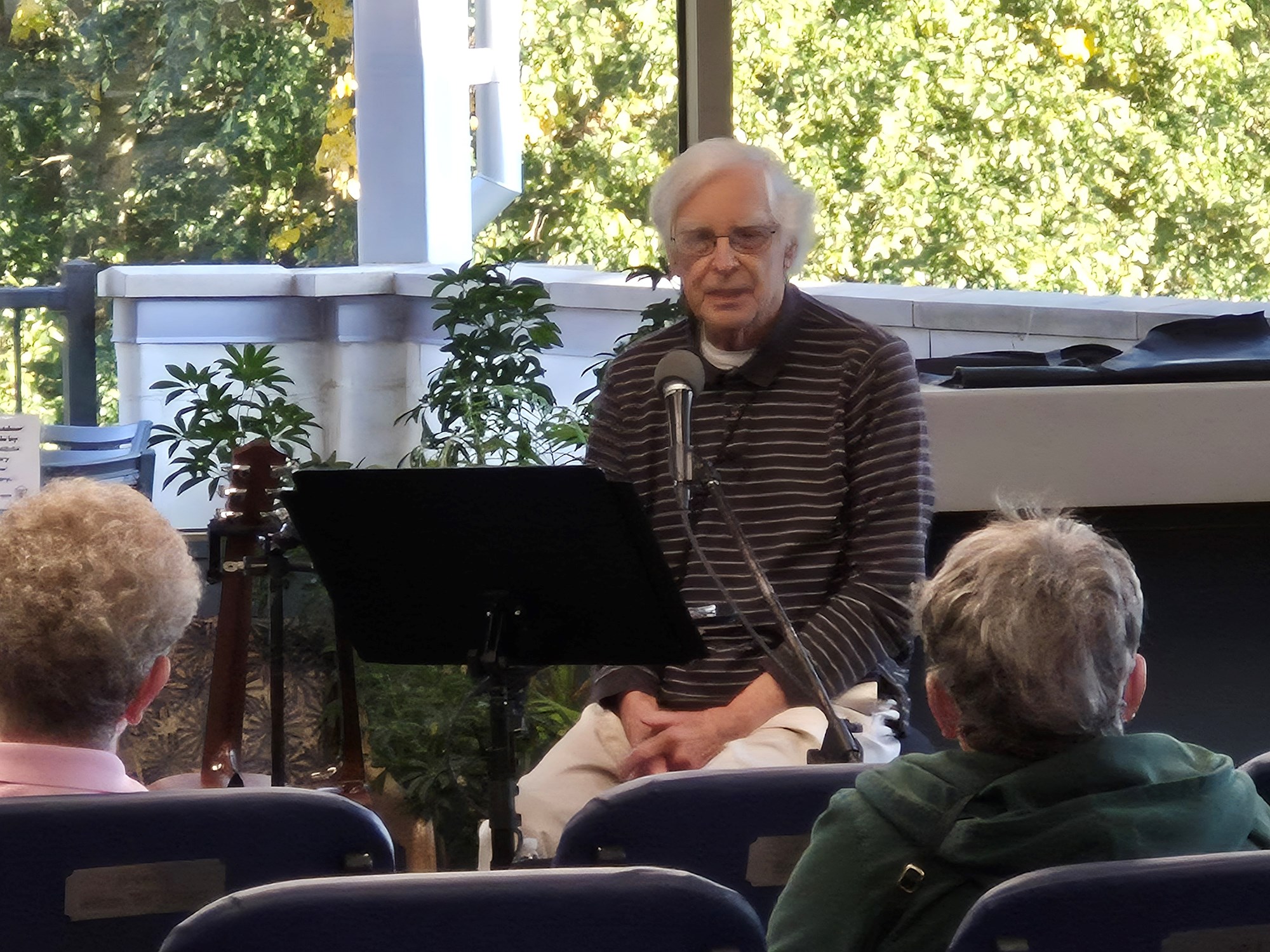 Ramblin' Richard performing in the main seating area of the library.