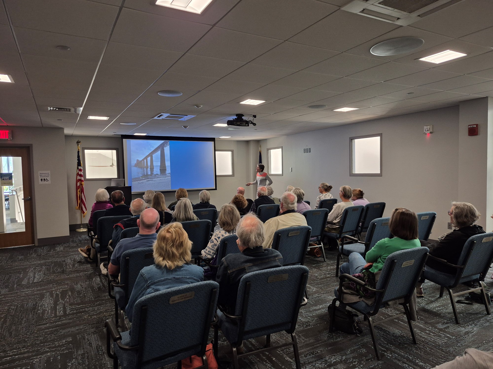 1 of 4: Gale Carey presenting in the Meeting Room.