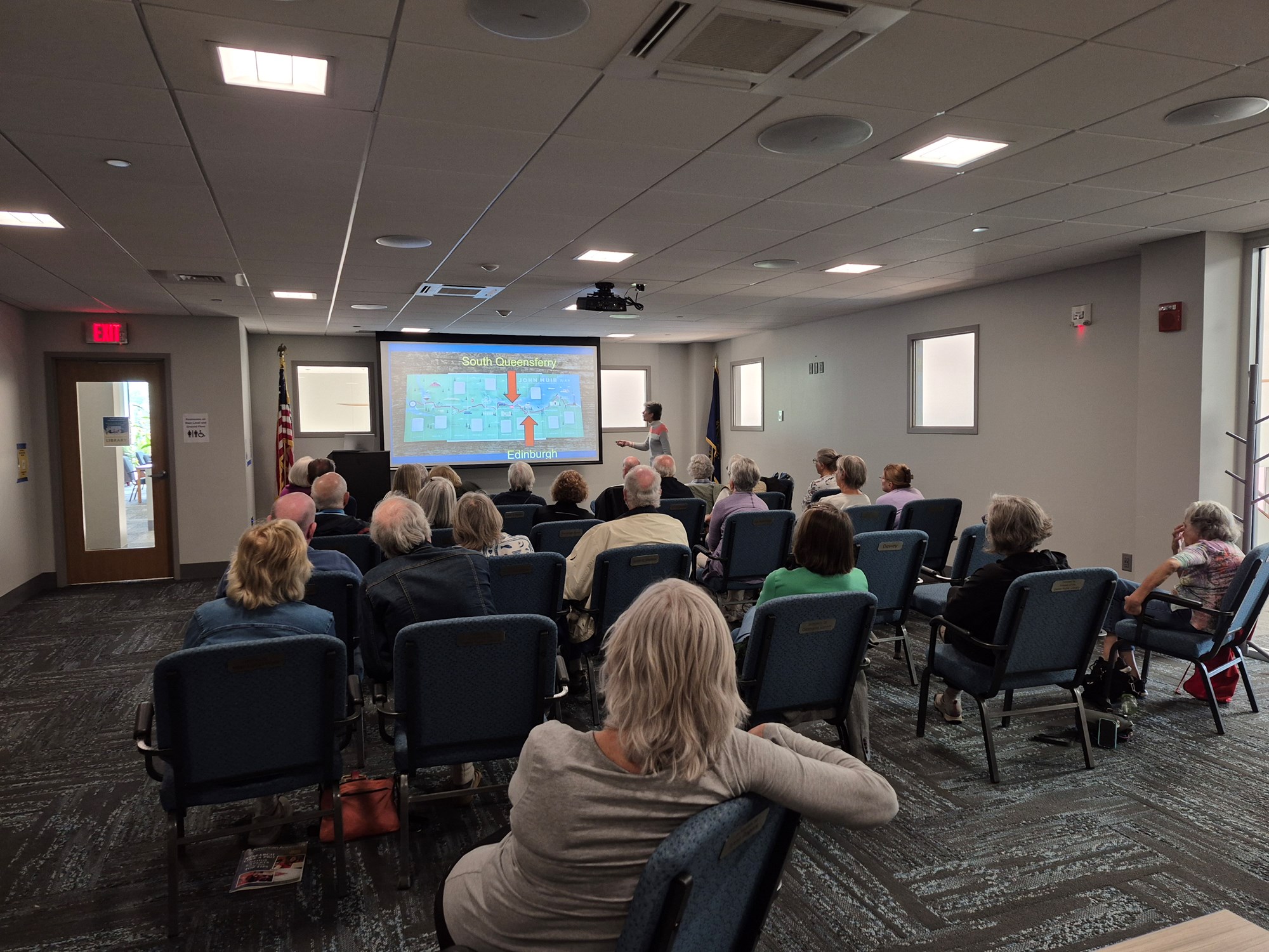 2 of 4: Gale Carey presenting in the Meeting Room.