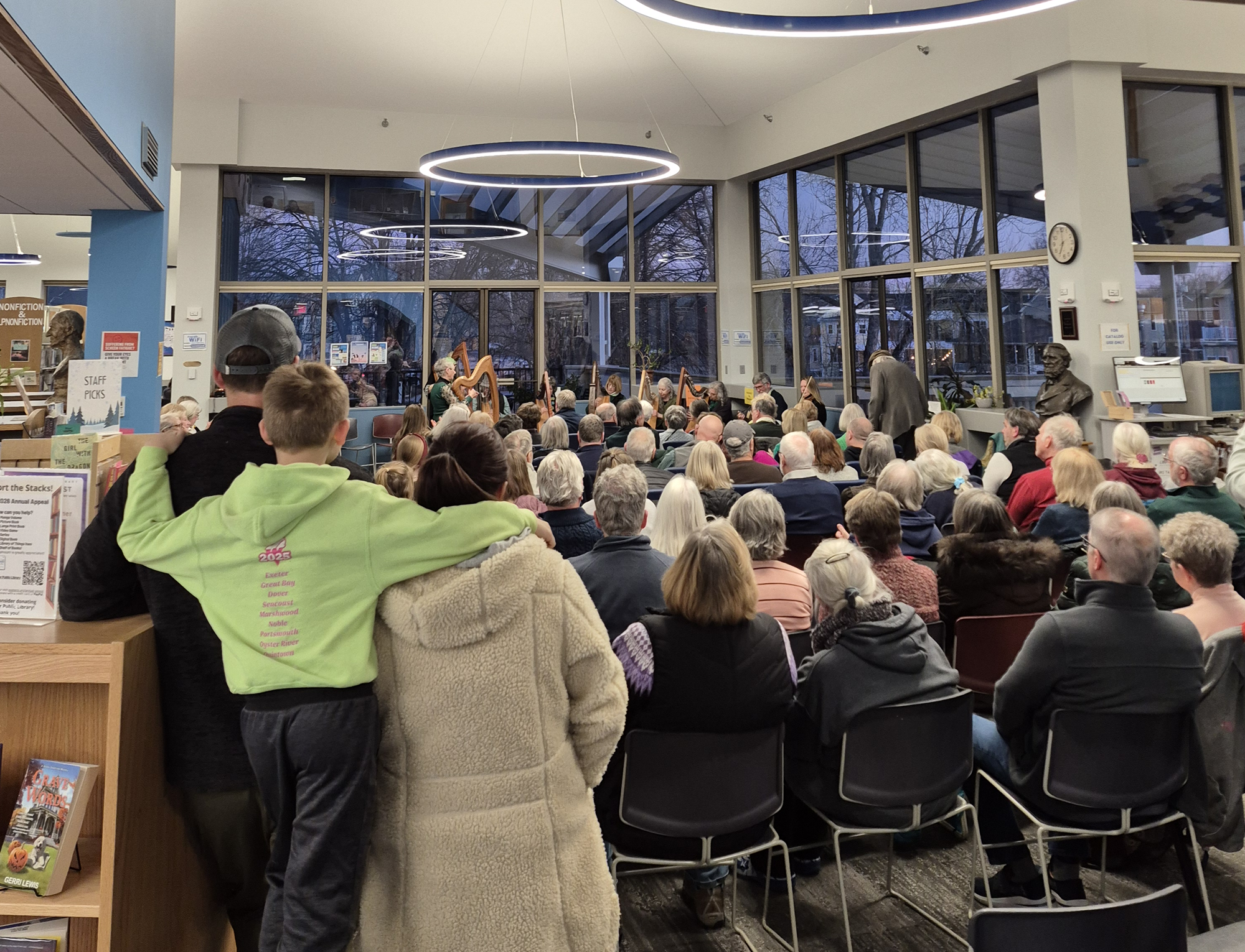 The New England Irish Orchestra performing on the main floor of the library.