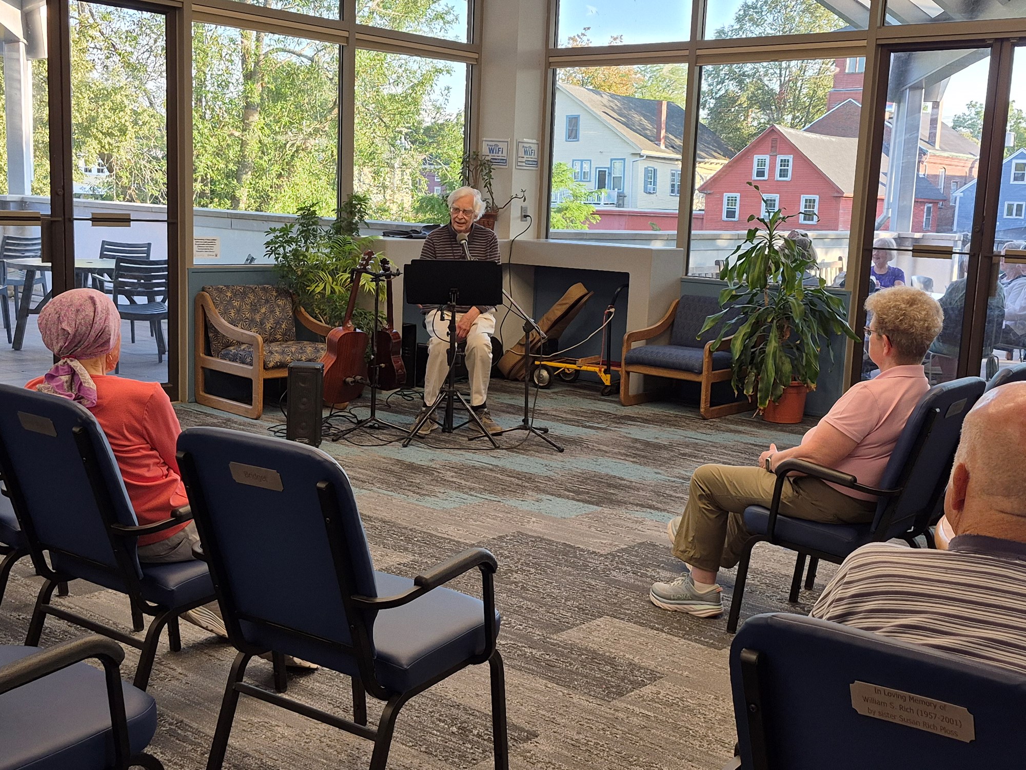 Ramblin' Richard performing in the main seating area of the library.
