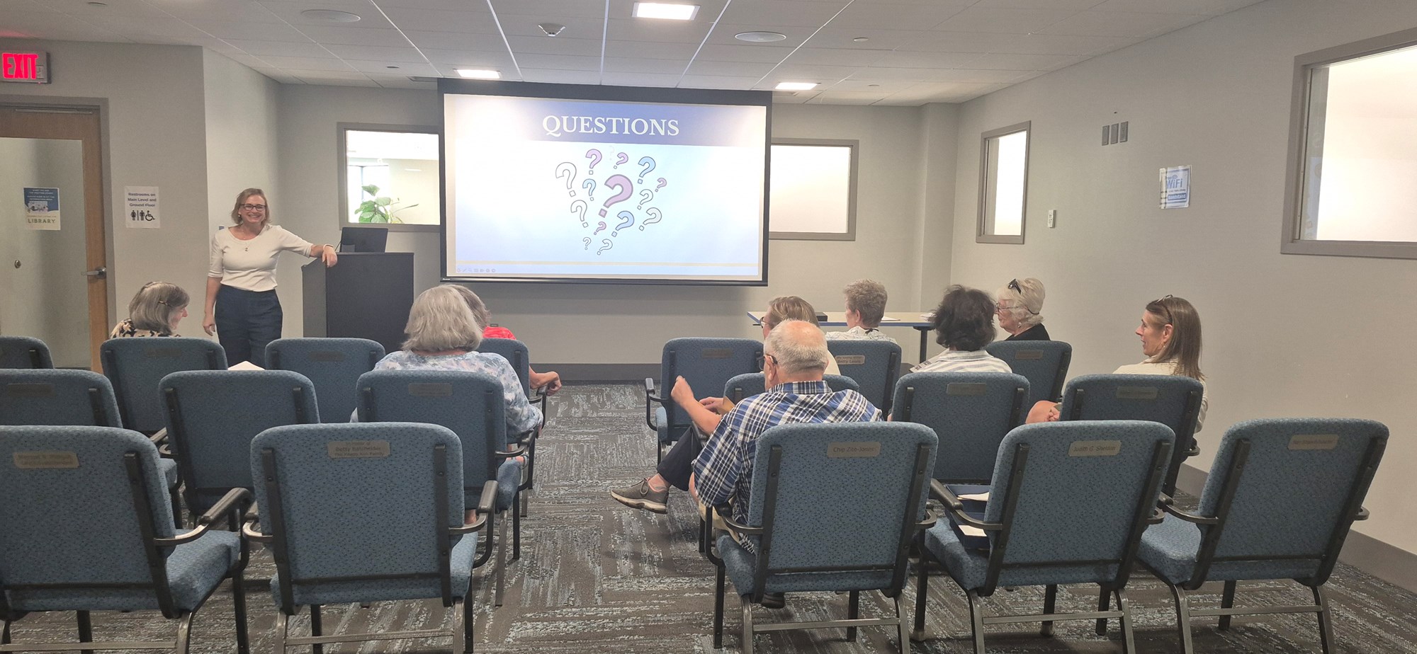 Patrons following along at the Don't Make Your History a Mystery presentation in the Meeting Room.