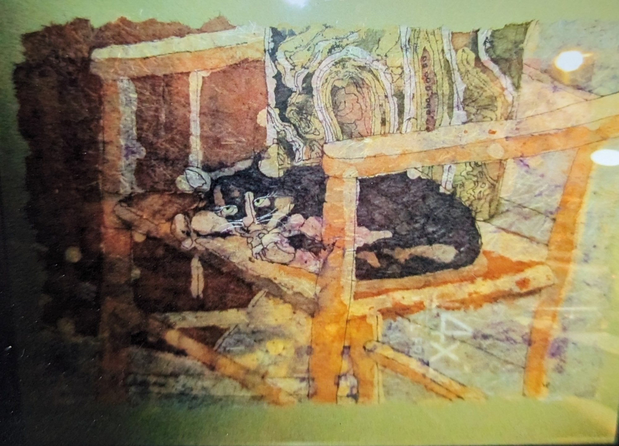 Batiking of a black cat sitting on a chair by March artist Larry Provencher. Batiking of a black cat sitting on a chair by March artist Larry Provencher.